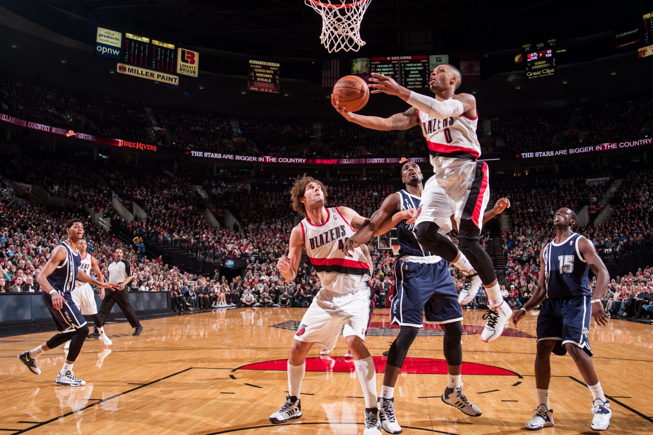 PORTLAND, OR - FEBRUARY 11: Damian Lillard #0 of the Portland Trail Blazers shoots against the Oklahoma City Thunder on February 11, 2014 at the Moda Center Arena in Portland, Oregon. NOTE TO USER: User expressly acknowledges and agrees that, by downloadi