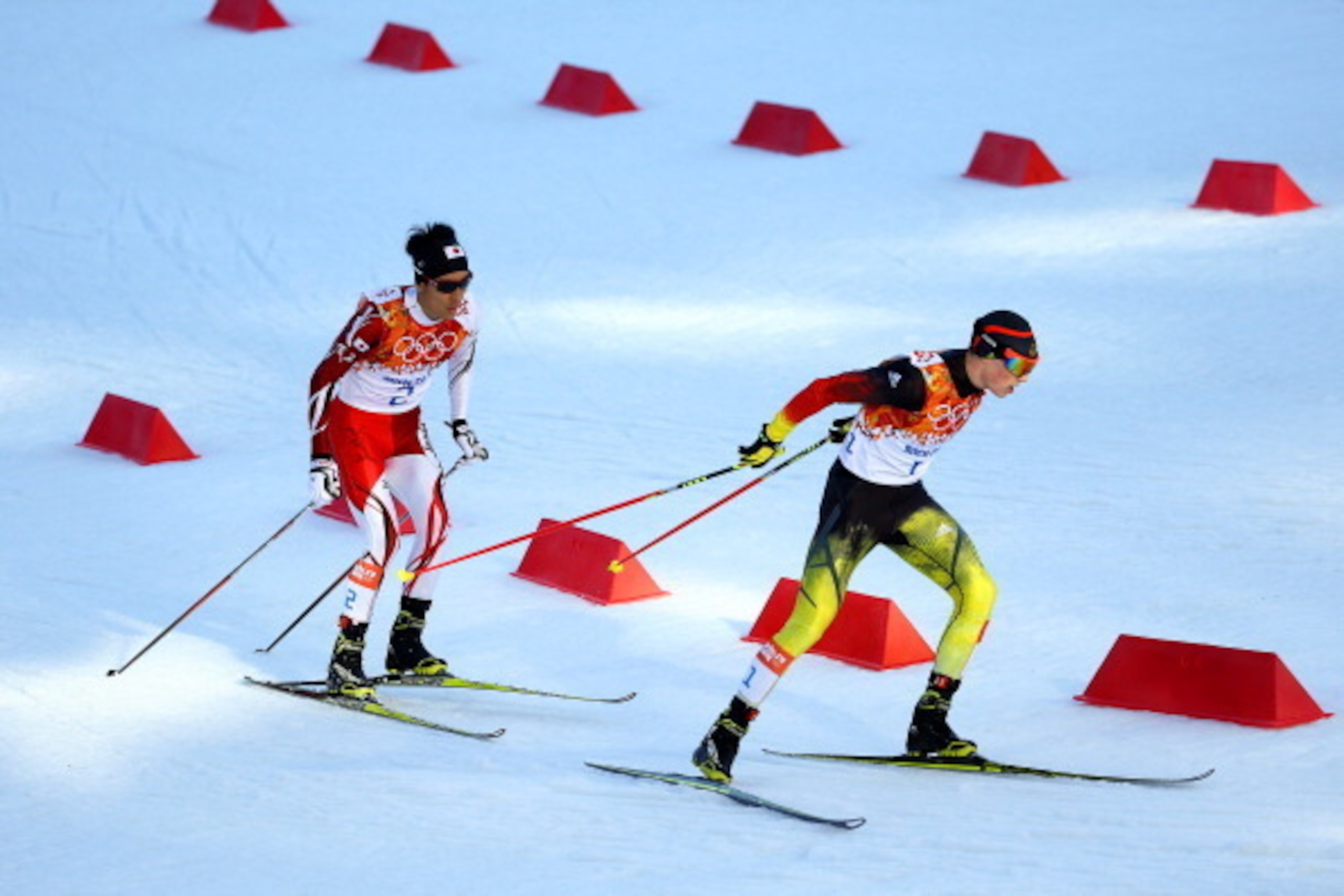 SOCHI, RUSSIA - FEBRUARY 12:  Eric Frenzel of Germany (R) and Akito Watabe of Japan (L) compete during the Nordic Combined Individual Gundersen Normal Hill and 10km Cross Country on day 5 of the Sochi 2014 Winter Olympics at the RusSki Gorki Nordic Combin