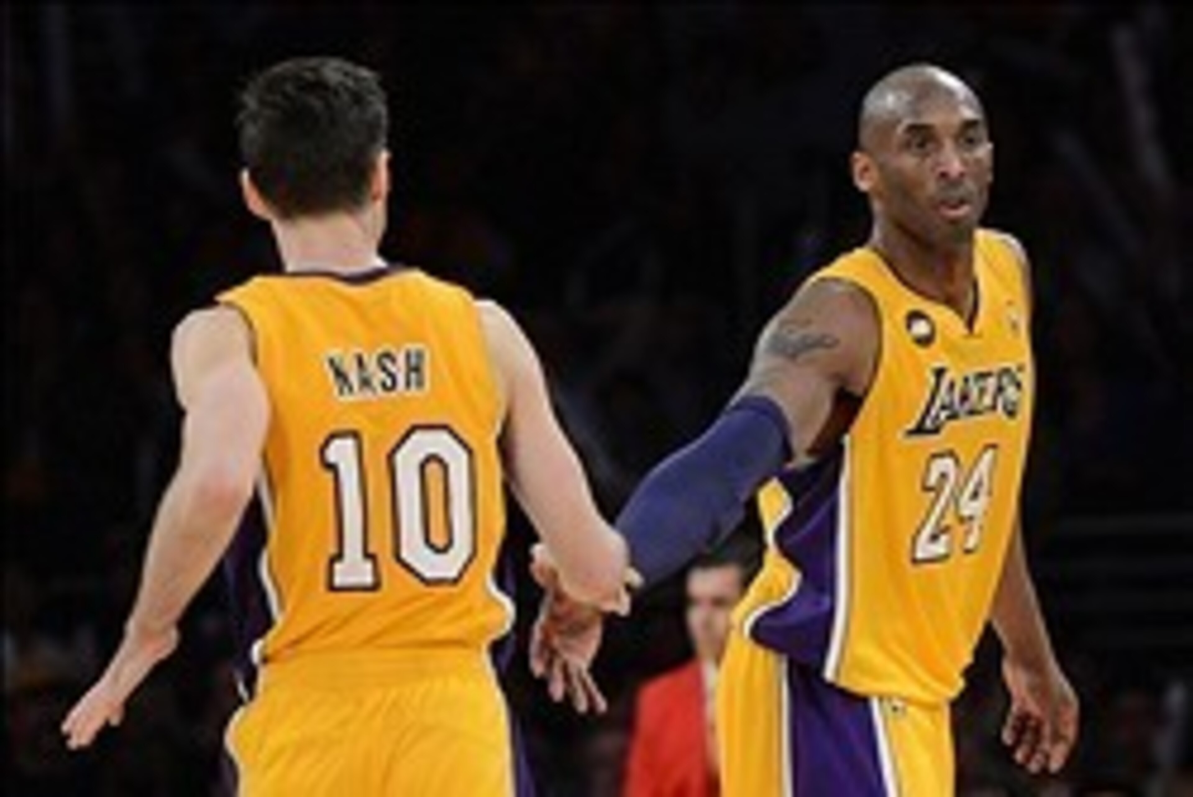 Mar 22, 2013; Los Angeles, CA, USA;  Los Angeles Lakers shooting guard Kobe Bryant (24) and point guard Steve Nash (10) in the second half of the game against the Washington Wizards at the Staples Center. Wizards won 103-100. Mandatory Credit: Jayne Kamin