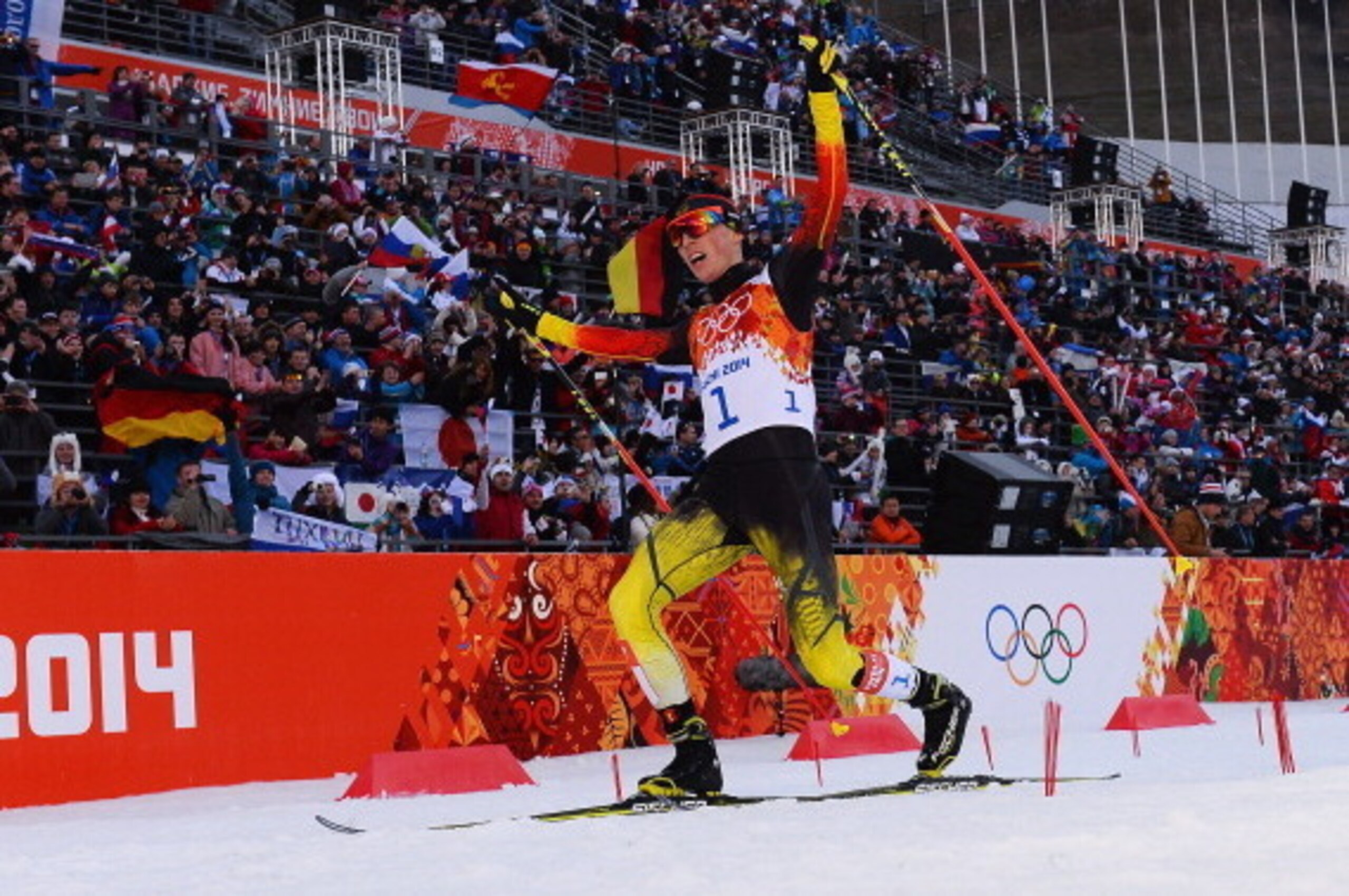 SOCHI, RUSSIA - FEBRUARY 12:  Eric Frenzel of Germany celebrates as he wins the gold medal during the Nordic Combined Individual Gundersen Normal Hill and 10km Cross Country on day 5 of the Sochi 2014 Winter Olympics at the RusSki Gorki Nordic Combined Sk