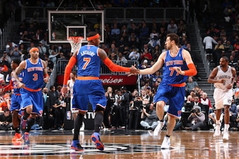 NEW YORK, NY - DECEMBER 5: Teammates Carmelo Anthony #7 of the New York Knicks and Andrea Bargnani #77 of the New York Knicks high five during a game against the Brooklyn Nets at Barclays Center on December 5, 2013 in the Brooklyn borough of New York City