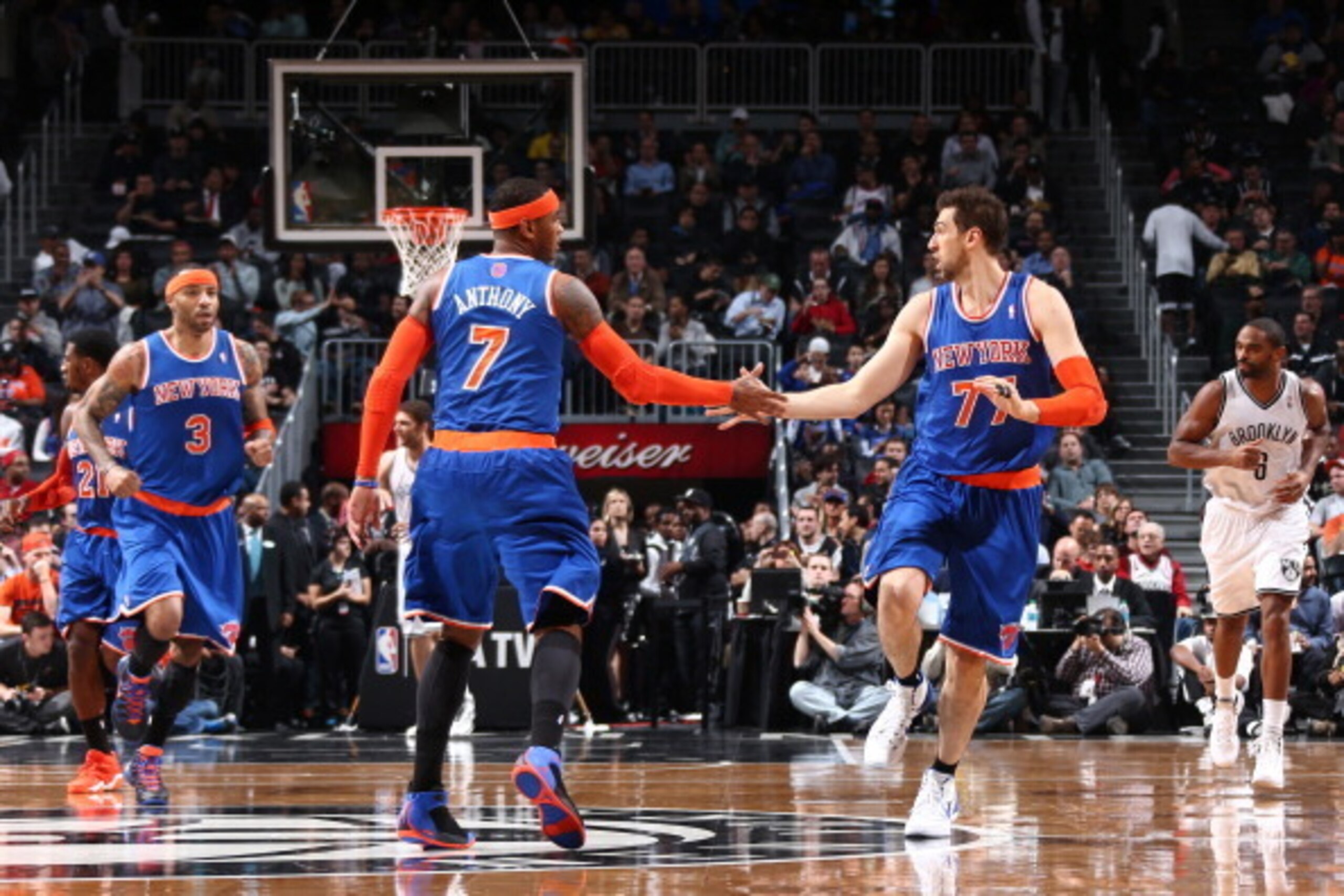 NEW YORK, NY - DECEMBER 5: Teammates Carmelo Anthony #7 of the New York Knicks and Andrea Bargnani #77 of the New York Knicks high five during a game against the Brooklyn Nets at Barclays Center on December 5, 2013 in the Brooklyn borough of New York City