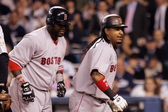 NEW YORK - APRIL 17:  Manny Ramirez #24 and David Ortiz #34 of the Boston Red Sox head back to the dugout after Ramirez' two run home run in the third inning against the New York Yankees on April 17, 2008 at Yankee Stadium in the Bronx borough of New York