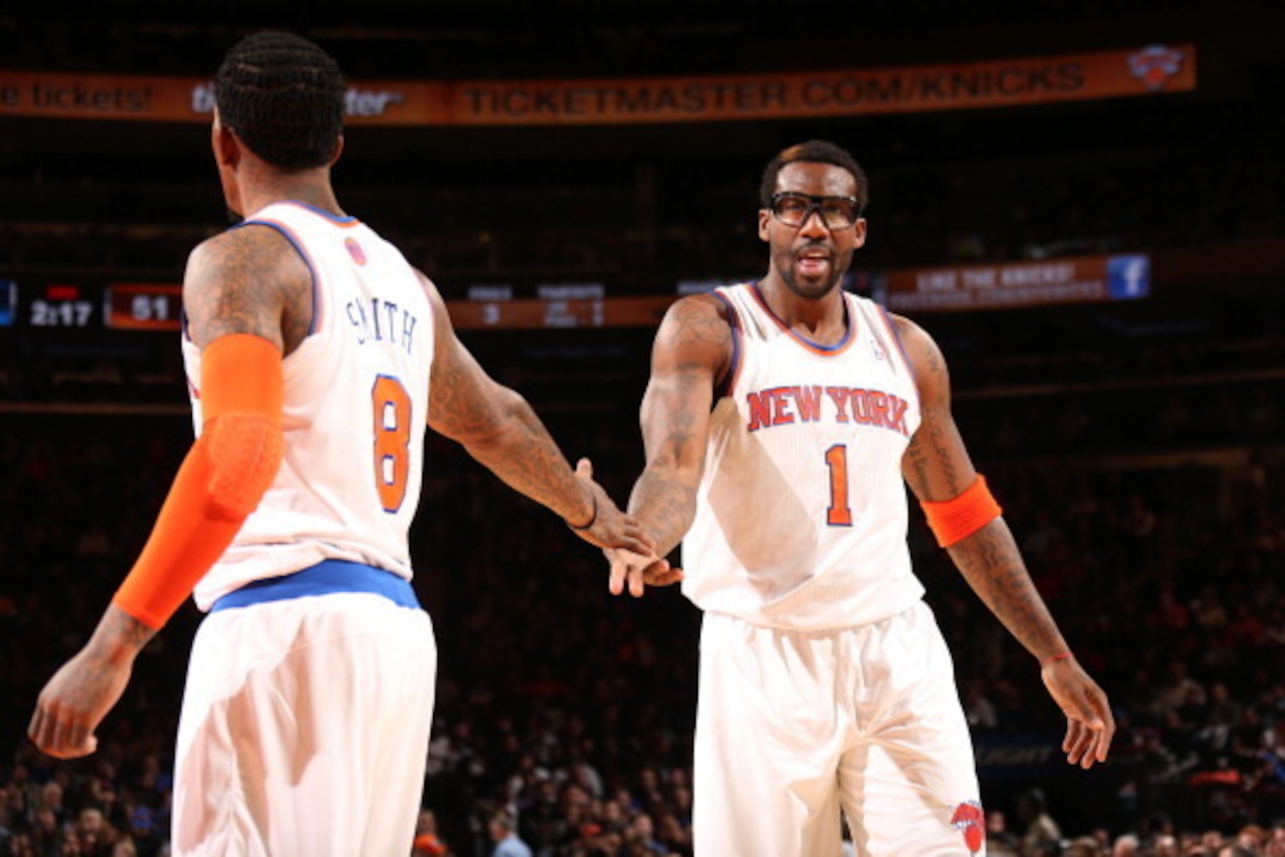 NEW YORK, NY - OCTOBER 25: Teammates J.R. Smith #8 and Amar'e Stoudemire #1 of the New York Knicks high five during a preseason game against the Charlotte Bobcats on October 25, 2013 at Madison Square Garden in New York City. NOTE TO USER: User expressly NEW YORK, NY - OCTOBER 25: Teammates J.R. Smith #8 and Amar'e Stoudemire #1 of the New York Knicks high five during a preseason game against the Charlotte Bobcats on October 25, 2013 at Madison Square Garden in New York City. NOTE TO USER: User expressly