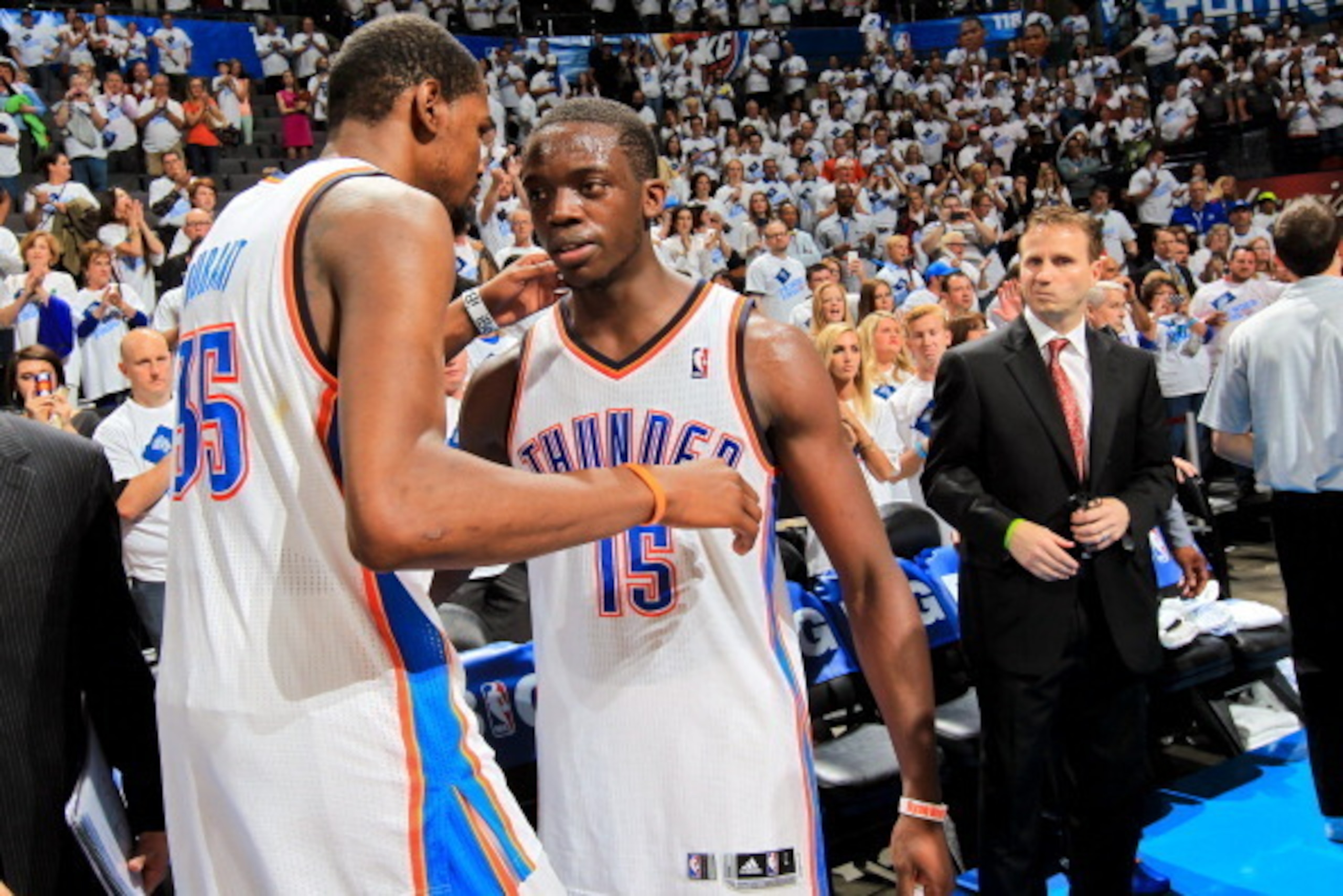 OKLAHOMA CITY, OK - MAY 15: Kevin Durant #35 of the Oklahoma City Thunder greets teammate Reggie Jackson #15 following their team's series loss to the Memphis Grizzlies in Game Five of the Western Conference Semifinals during the 2013 NBA Playoffs on May 