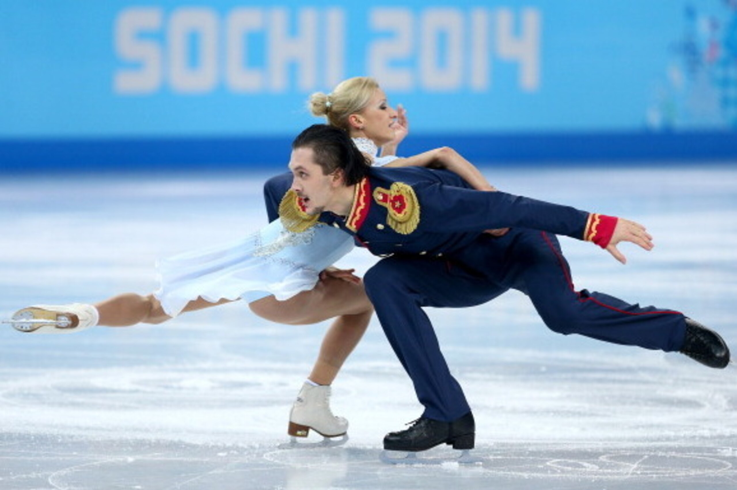 SOCHI, RUSSIA - FEBRUARY 11:  Tatiana Volosozhar and Maxim Trankov of Russia compete during the Figure Skating Pairs Short Program on day four of the Sochi 2014 Winter Olympics at Iceberg Skating Palace on February 11, 2014 in Sochi, Russia.  (Photo by Pa
