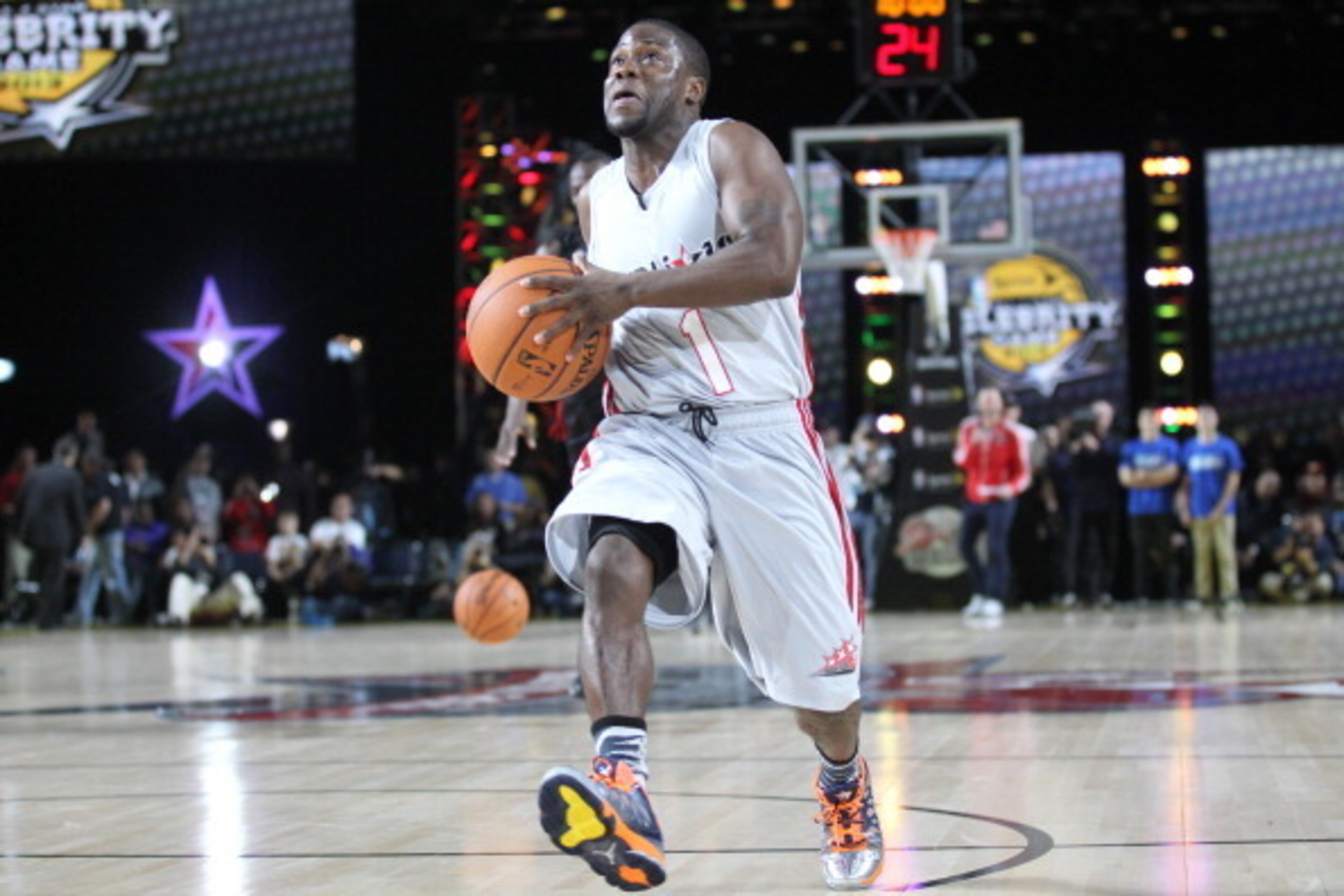 HOUSTON, TX - FEBRUARY 15: Comedian Kevin Hart challenges sprinter Usain Bolt to a race during the Sprint Celebrity Game at Jam Session during NBA All Star Weekend on February 15, 2013 at the George R. Brown in Houston, Texas.  NOTE TO USER: User expressl