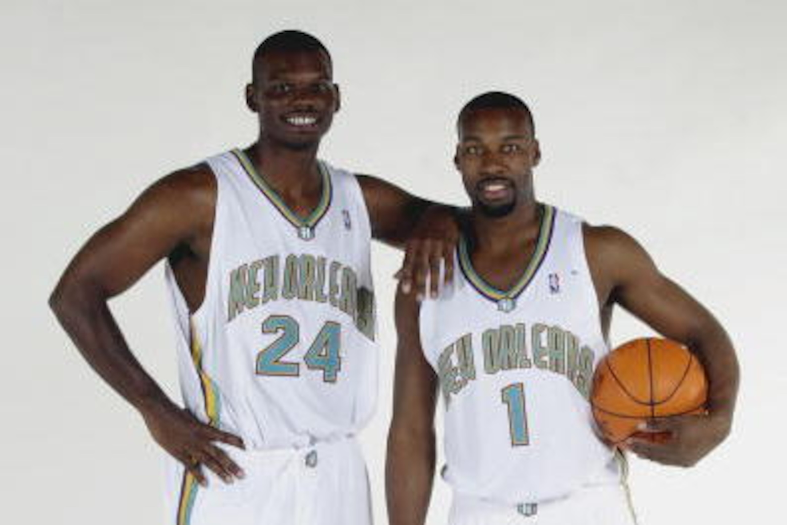WESTWEGO, LA - OCTOBER 2:  Jamal Mashburn #24 and Baron Davis #1 of the New Orleans Hornets pose for a portrait during NBA Media Day at Alario Center on October 2, 2003 in Westwego, Louisana.  NOTE TO USER: User expressly acknowledges and agrees that, by 