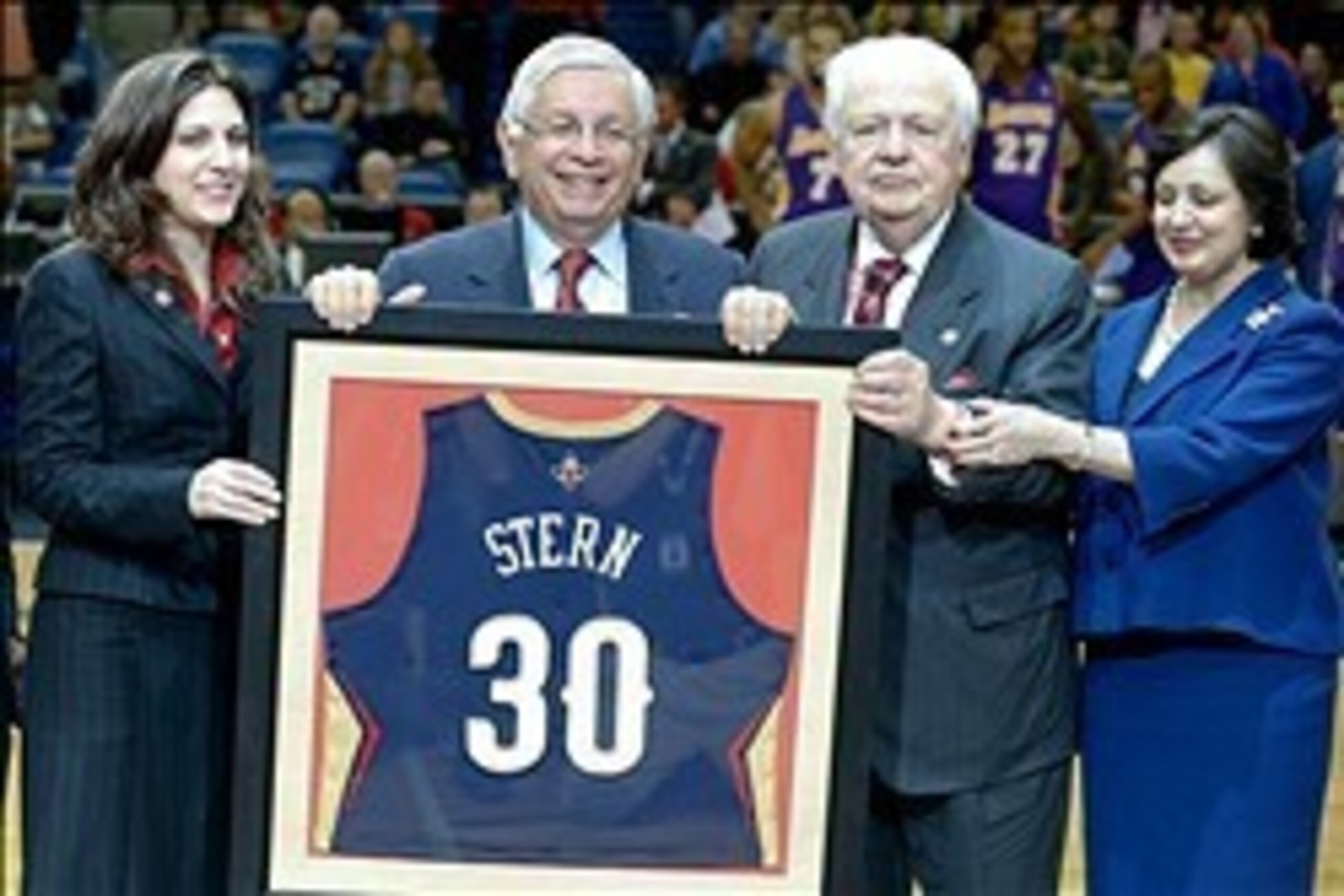 Nov 8, 2013; New Orleans, LA, USA;   NBA commissioner David Stern (center) with New Orleans Pelicans owner Tom Benson (right) with his wife Gayle Benson and owner/vice chairman of the board Rita Benson LeBlanc (left) for a presentation honoring Stern's 30