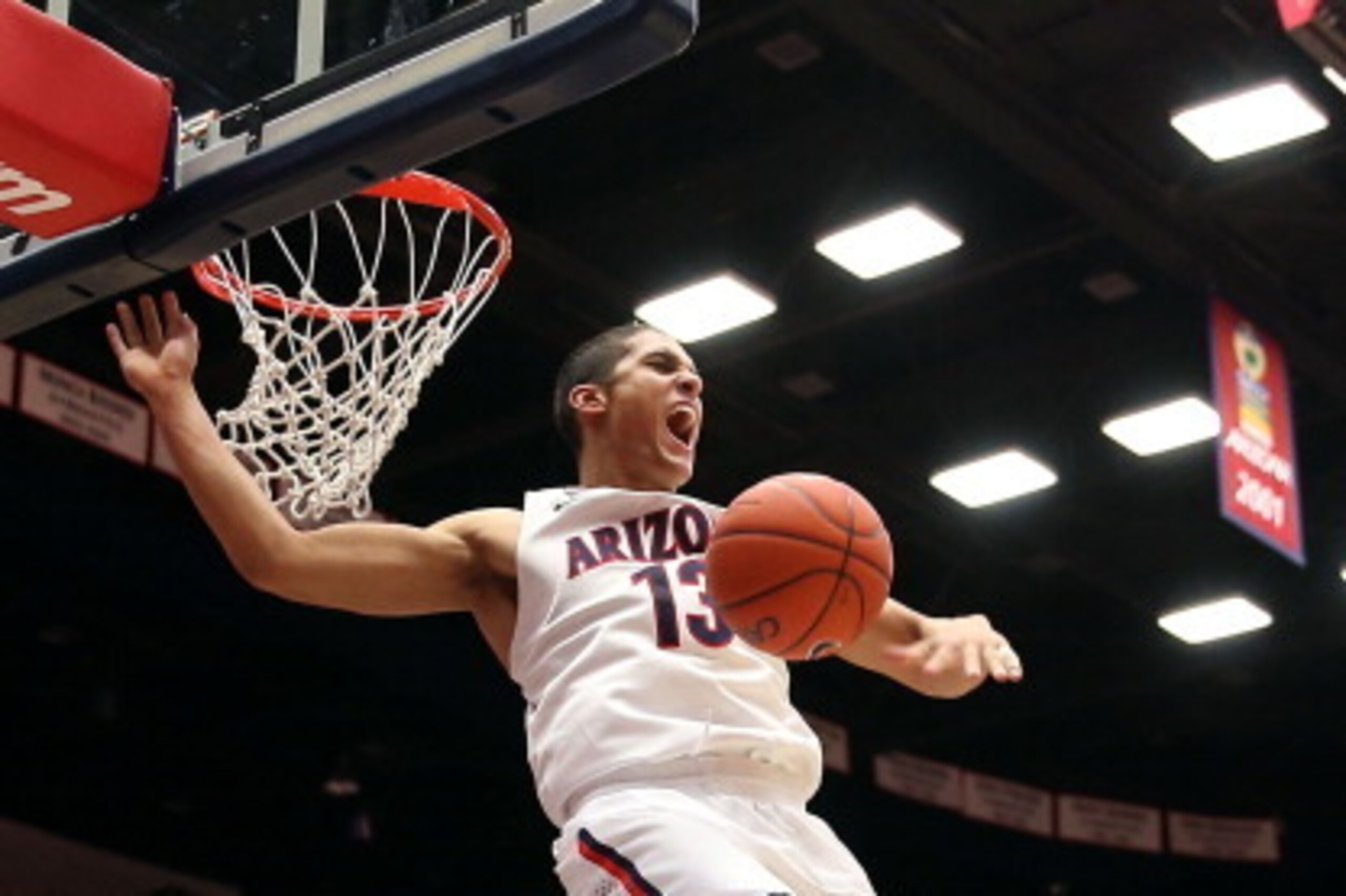 TUCSON, AZ - JANUARY 26:  Nick Johnson #13 of the Arizona Wildcats slam dunks the ball against the Utah Utes during the second half of the college basketball game at McKale Center on January 26, 2014 in Tucson, Arizona.  The Wildcats defeated the Utes 65-