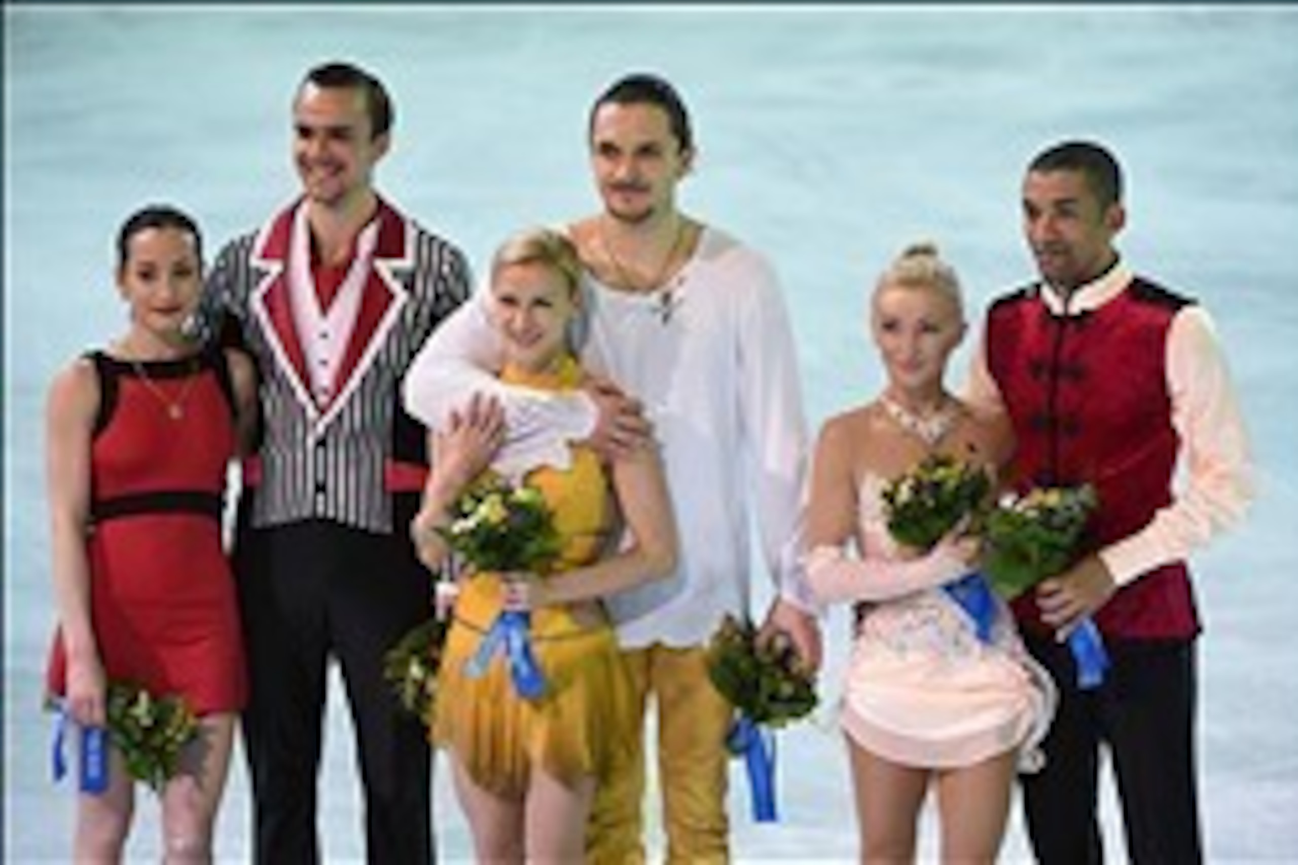 Feb 12, 2014; Sochi, RUSSIA; Tatiana Volosozhar and Maxim Trankov (RUS) (center), Ksenia Stolbova and Fedor Klimov (RUS) (left), and Bronze medalists Aliona Savchenko and Robin Szolkowy (GER) celebrate winning the gold, silver, and bronze medals, respecti