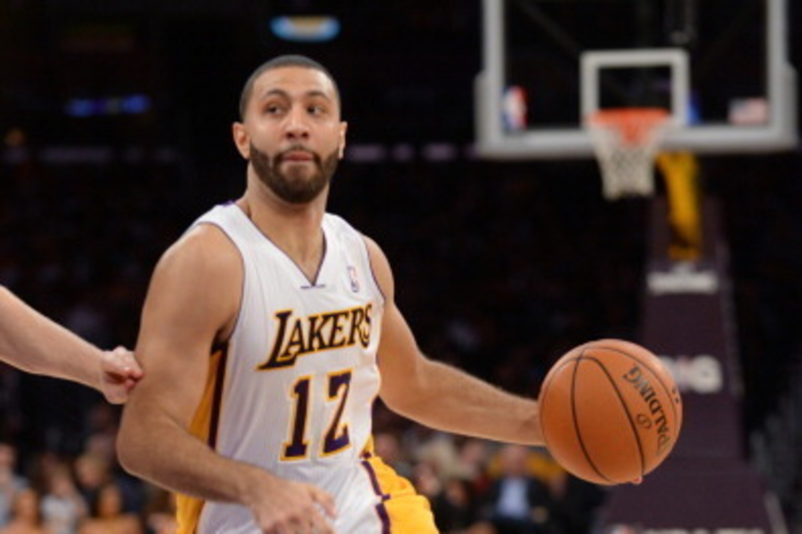 LOS ANGELES, CA - FEBRUARY 9: Kendall Marshall #12 of the Los Angeles Lakers drives to the basket during a game against the Chicago Bulls at STAPLES Center on February 9, 2014 in Los Angeles, California. NOTE TO USER: User expressly acknowledges and agree
