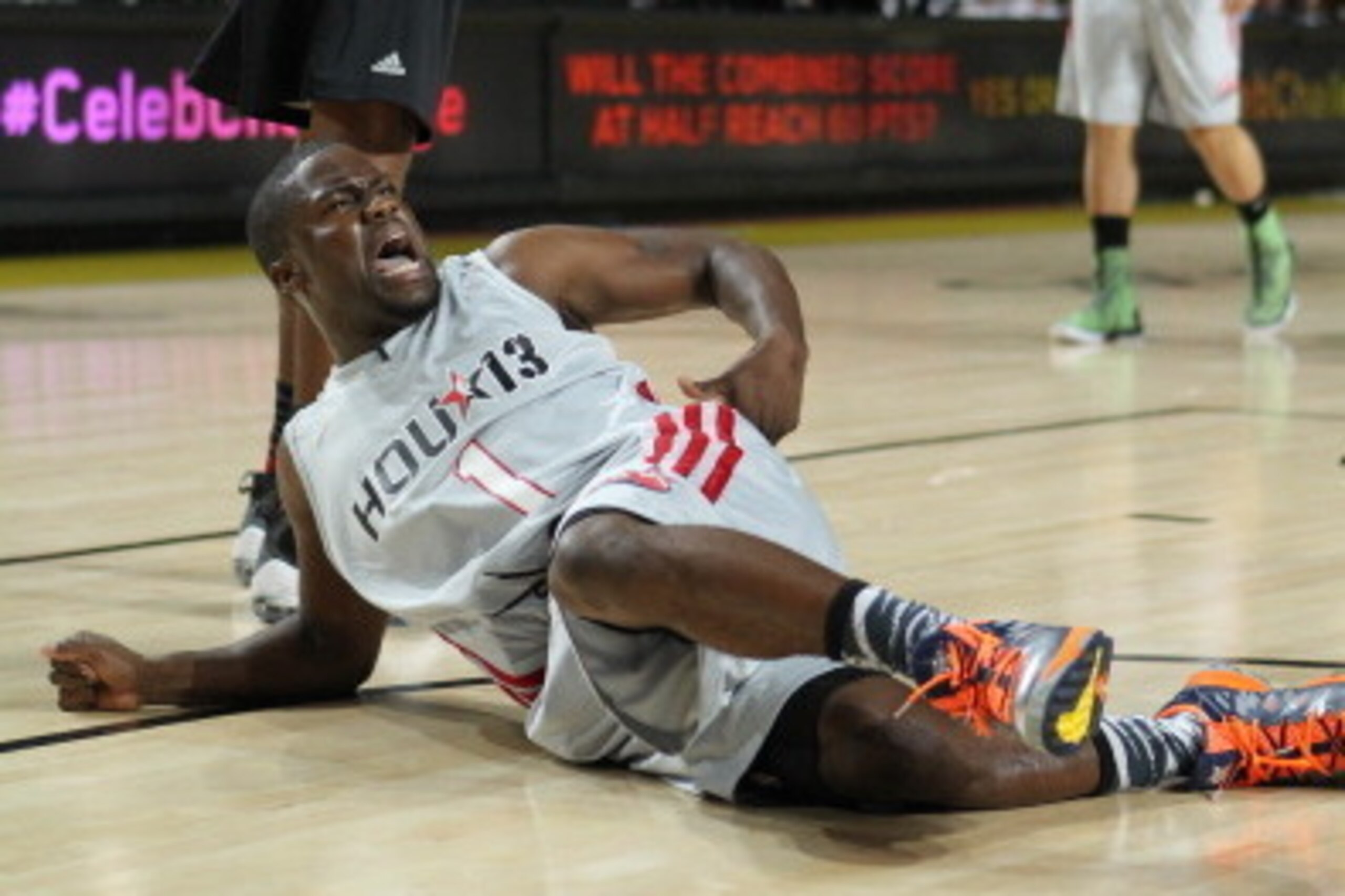 HOUSTON, TX - FEBRUARY 15: Comedian Kevin Hart of the West team reacts to a play against Bruce Bowen of the East team during the Sprint NBA All-Star Celebrity Game in Sprint Arena at Jam Session during the NBA All-Star Weekend on February 15, 2013 at the 