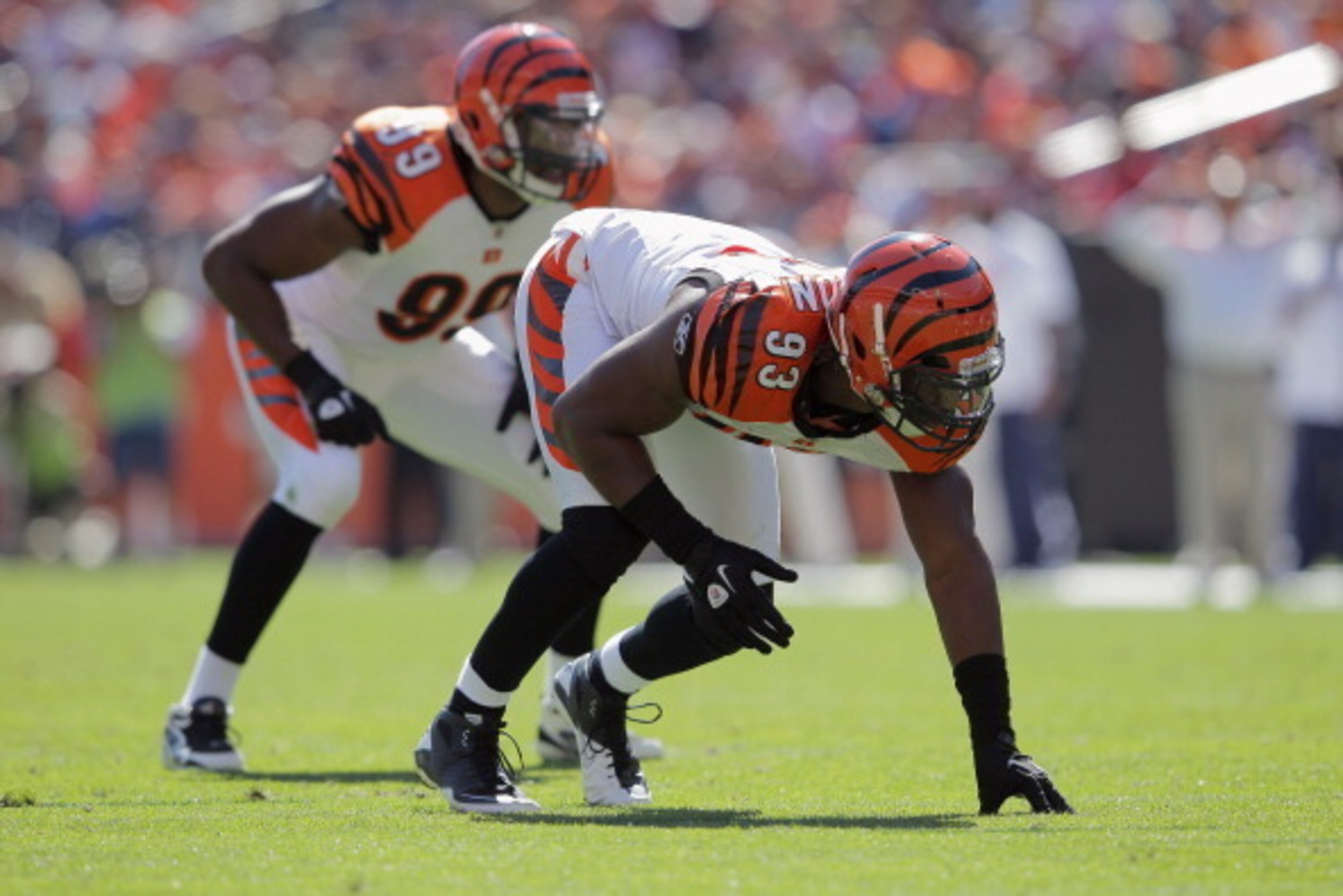 DENVER, CO - SEPTEMBER 18:  Defensive end Michael Johnson #93 of the Cincinnati Bengals and linebacker Manny Lawson #99 of the Cincinnati Bengals defend agains the Denver Broncos at Sports Authority Field at Mile High on September 18, 2011 in Denver, Colo