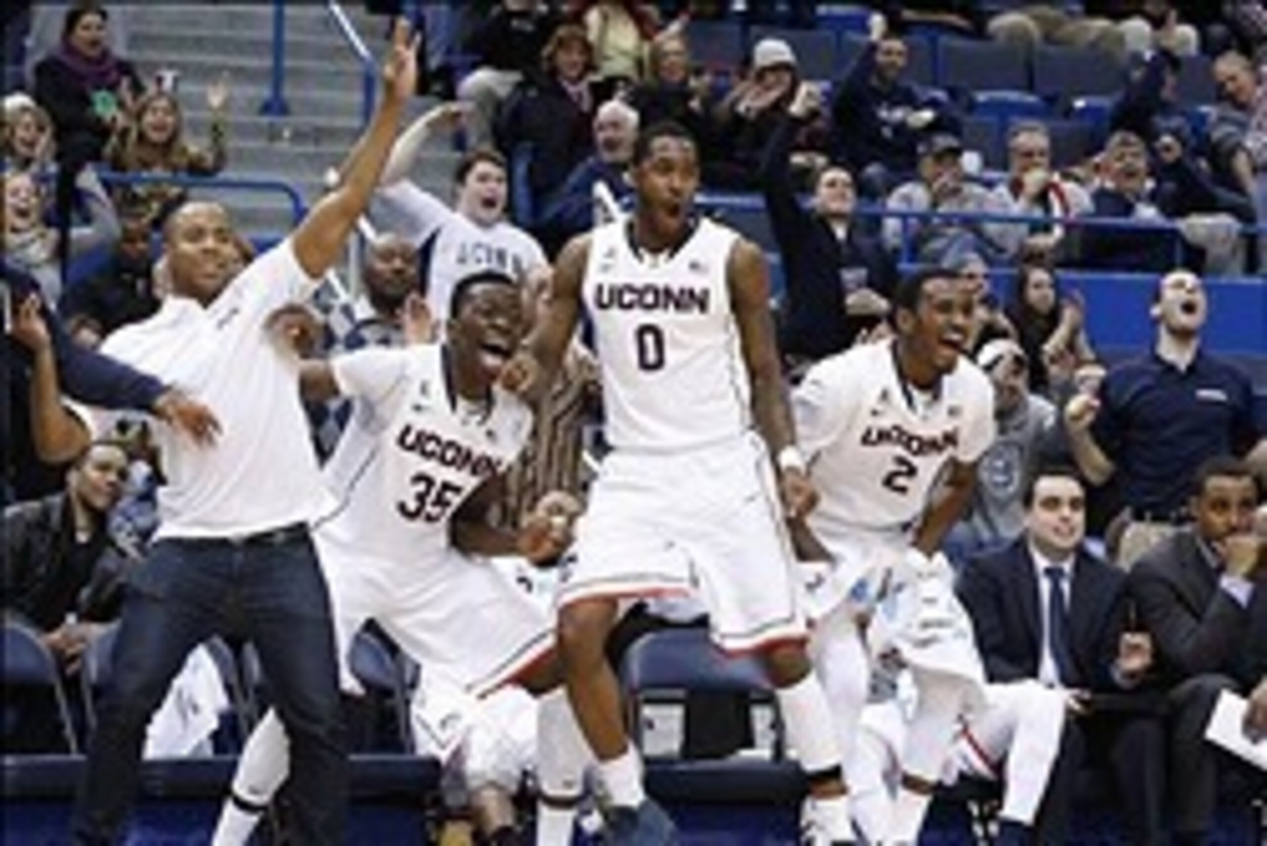 Feb 12, 2014; Hartford, CT, USA; The Connecticut Huskies bench reacts to a basket by guard Pat Lenehan (14) (not pictured) as they take on the South Florida Bulls in the second half at XL Center. UConn defeated the Bulls 83-40. Mandatory Credit: David But