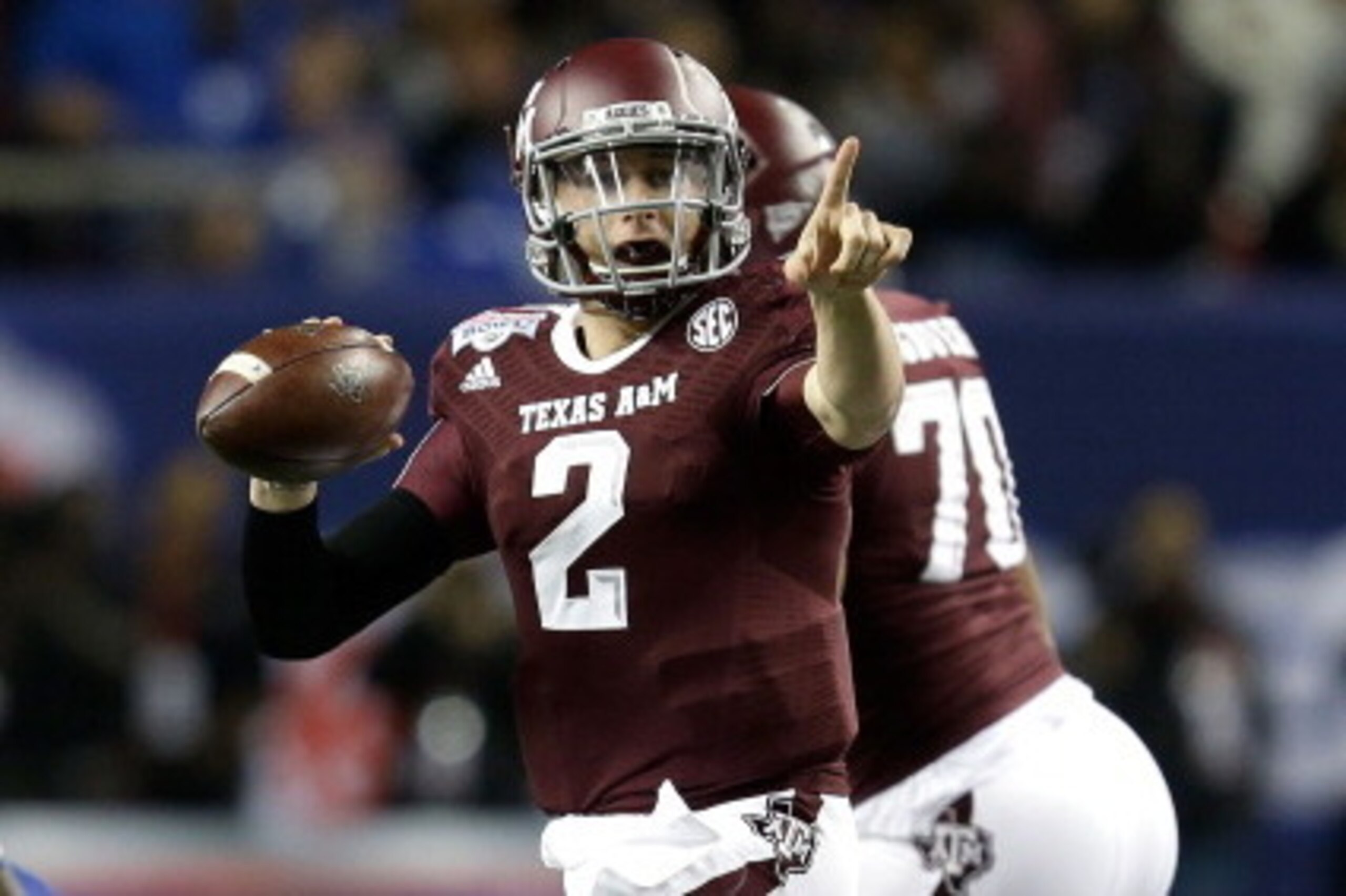 ATLANTA, GA - DECEMBER 31:  Quarterback Johnny Manziel #2 of the Texas A&M Aggies points and looks downfield to pass during the the Chick-fil-A Bowl game against the Duke Blue Devils at the Georgia Dome on December 31, 2013 in Atlanta, Georgia.  (Photo by