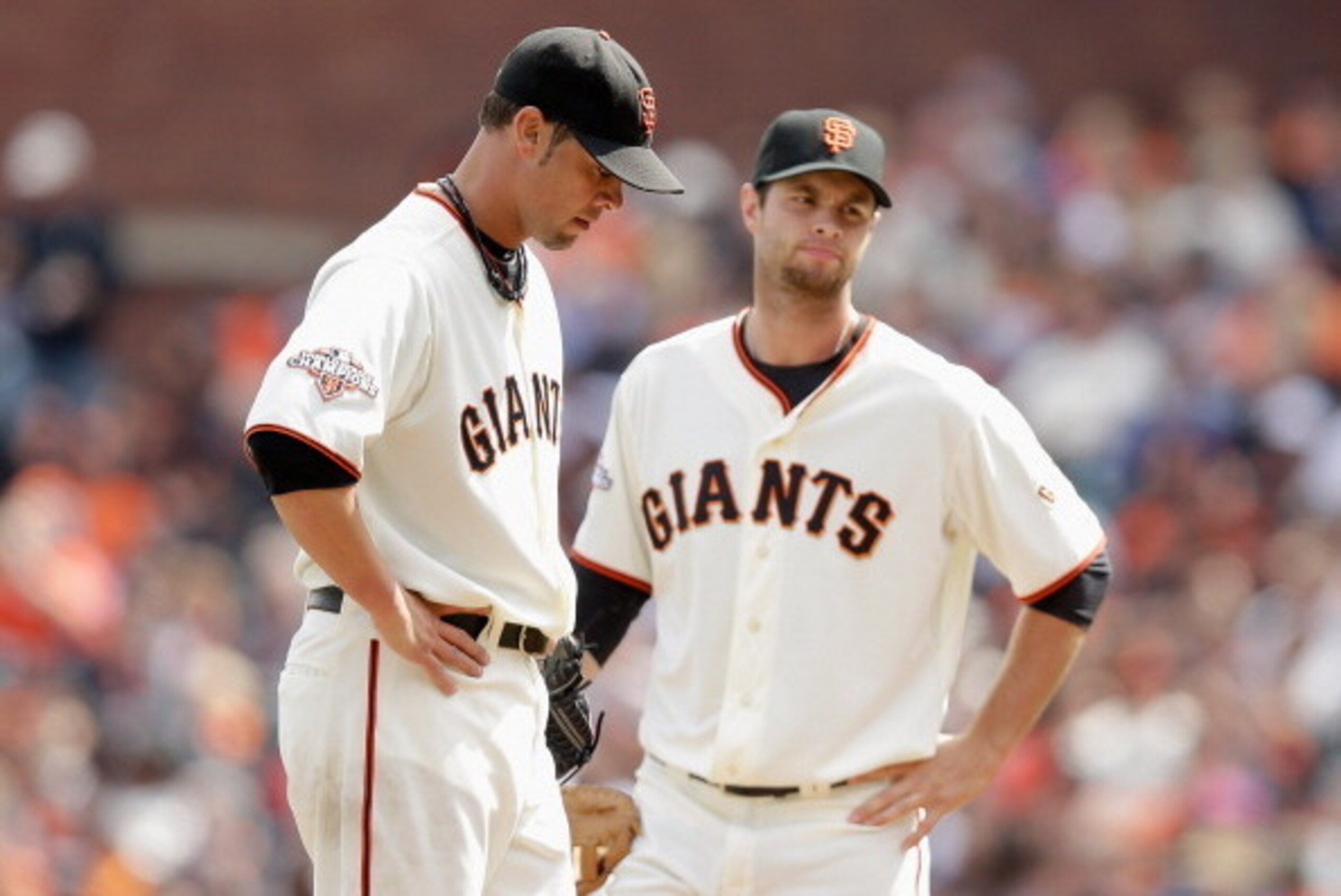SAN FRANCISCO, CA - APRIL 06:  Ryan Vogelsong #32 and Brandon Belt #9 of the San Francisco Giants wait on the pitching mound for manager Bruce Bochy to come take Vogelsong out of the game in the sixth inning of their game against the St. Louis Cardinals a