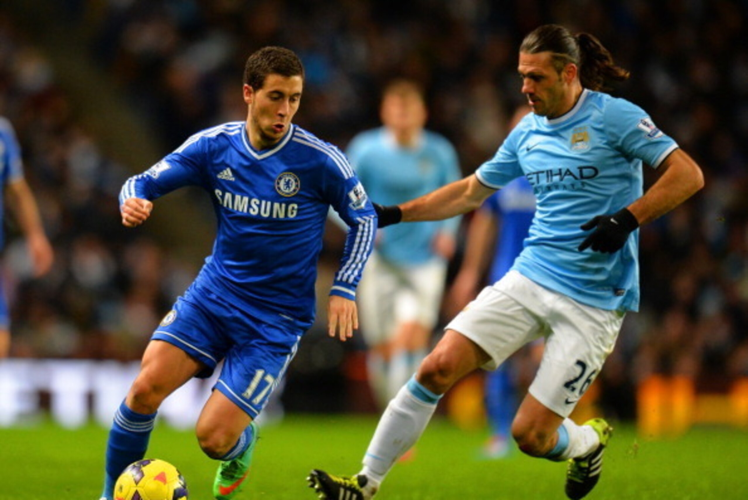 MANCHESTER, ENGLAND - FEBRUARY 03:  Eden Hazard of Chelsea is marshalled by Martin Demichelis of Manchester City during the Barclays Premier League match between Manchester City and Chelsea at Etihad Stadium on February 3, 2014 in Manchester, England.  (P