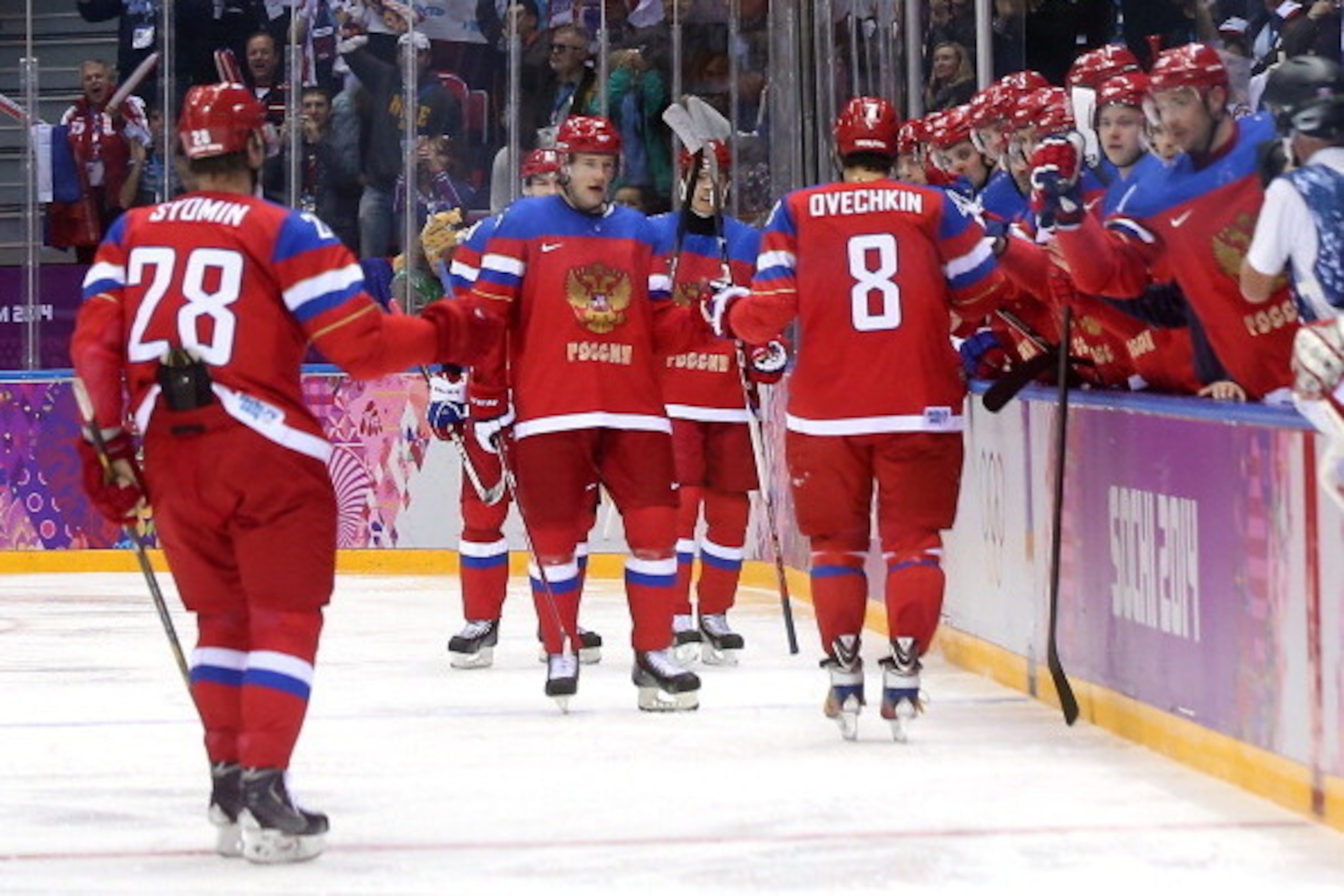 SOCHI, RUSSIA - FEBRUARY 13:  Alexander Ovechkin #8 of Russia celebrates after scoring a goal with teammates in the first period against Slovenia during the Men's Ice Hockey Preliminary Round Group A game on day six of the Sochi 2014 Winter Olympics at Bo