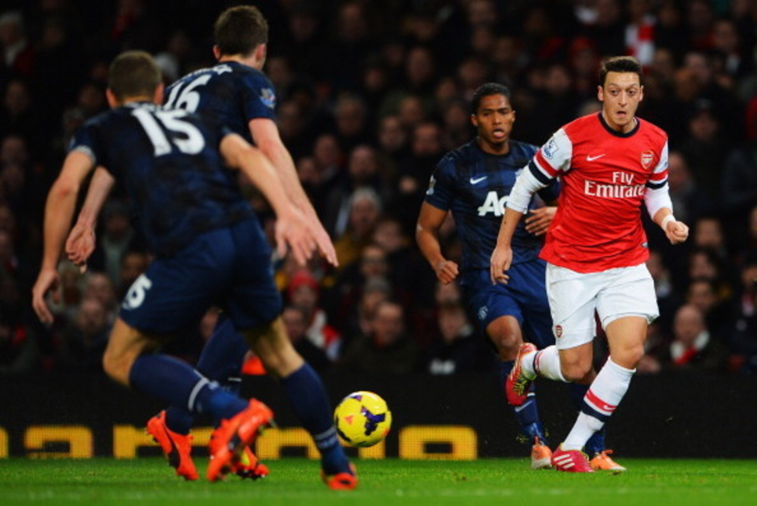 LONDON, ENGLAND - FEBRUARY 12: Mesut Ozil of Arsenal runs at the Manchester United defence during the Barclays Premier League match between Arsenal and Manchester United at the Emirates Stadium on February 12, 2014 in London, England. (Photo by Michael LONDON, ENGLAND - FEBRUARY 12: Mesut Ozil of Arsenal runs at the Manchester United defence during the Barclays Premier League match between Arsenal and Manchester United at the Emirates Stadium on February 12, 2014 in London, England. (Photo by Michael
