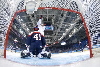 SOCHI, RUSSIA - FEBRUARY 13:  Phil Kessel #81 of United States scores a goal against Jaroslav Halak #41 of Slovakia in the second period during the Men's Ice Hockey Preliminary Round Group A game on day six of the Sochi 2014 Winter Olympics at Shayba Aren