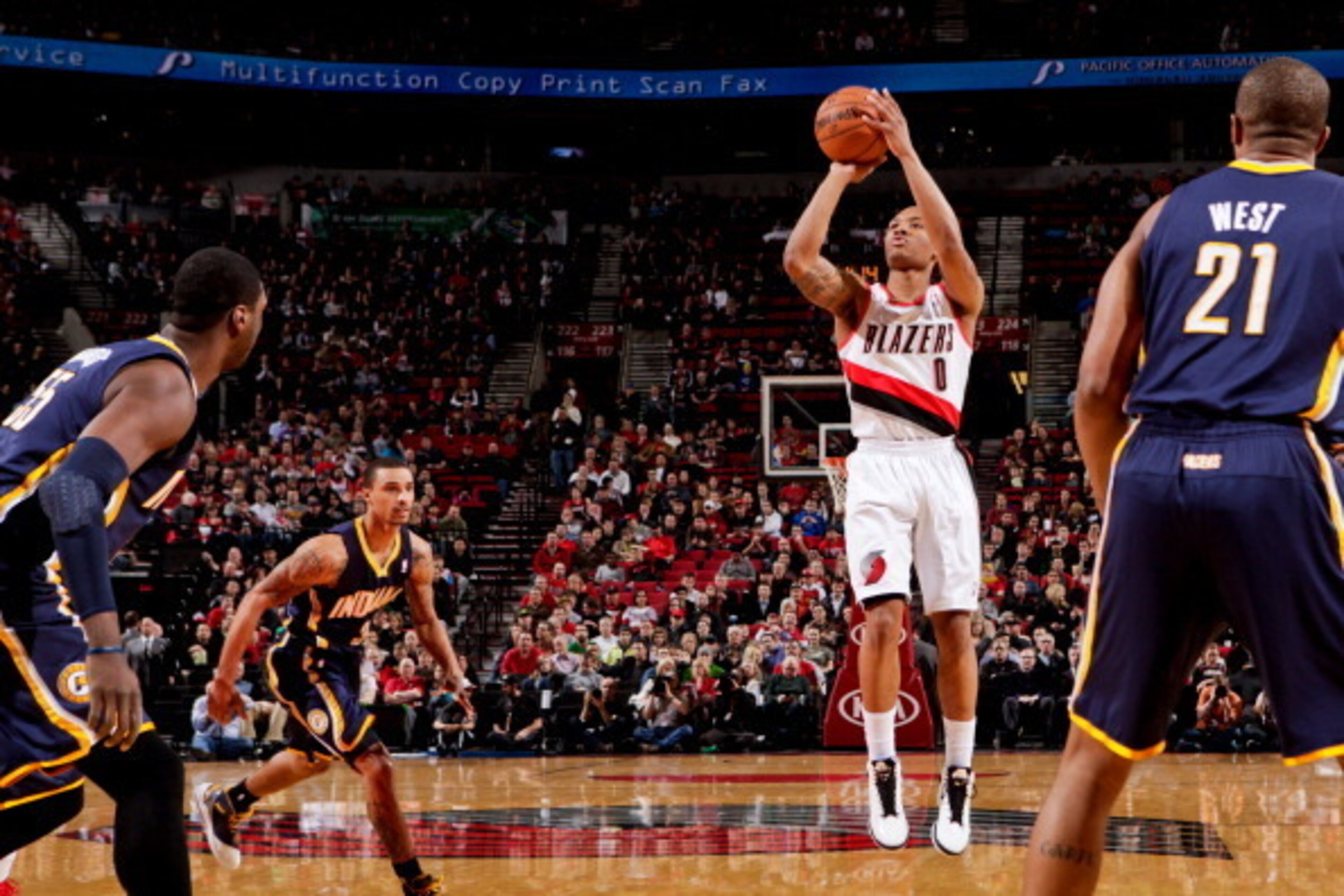 PORTLAND, OR - JANUARY 23: Damian Lillard #0 of the Portland Trail Blazers shoots a three-pointer against the Indiana Pacers on January 23, 2013 at the Rose Garden Arena in Portland, Oregon. NOTE TO USER: User expressly acknowledges and agrees that, by do PORTLAND, OR - JANUARY 23: Damian Lillard #0 of the Portland Trail Blazers shoots a three-pointer against the Indiana Pacers on January 23, 2013 at the Rose Garden Arena in Portland, Oregon. NOTE TO USER: User expressly acknowledges and agrees that, by do