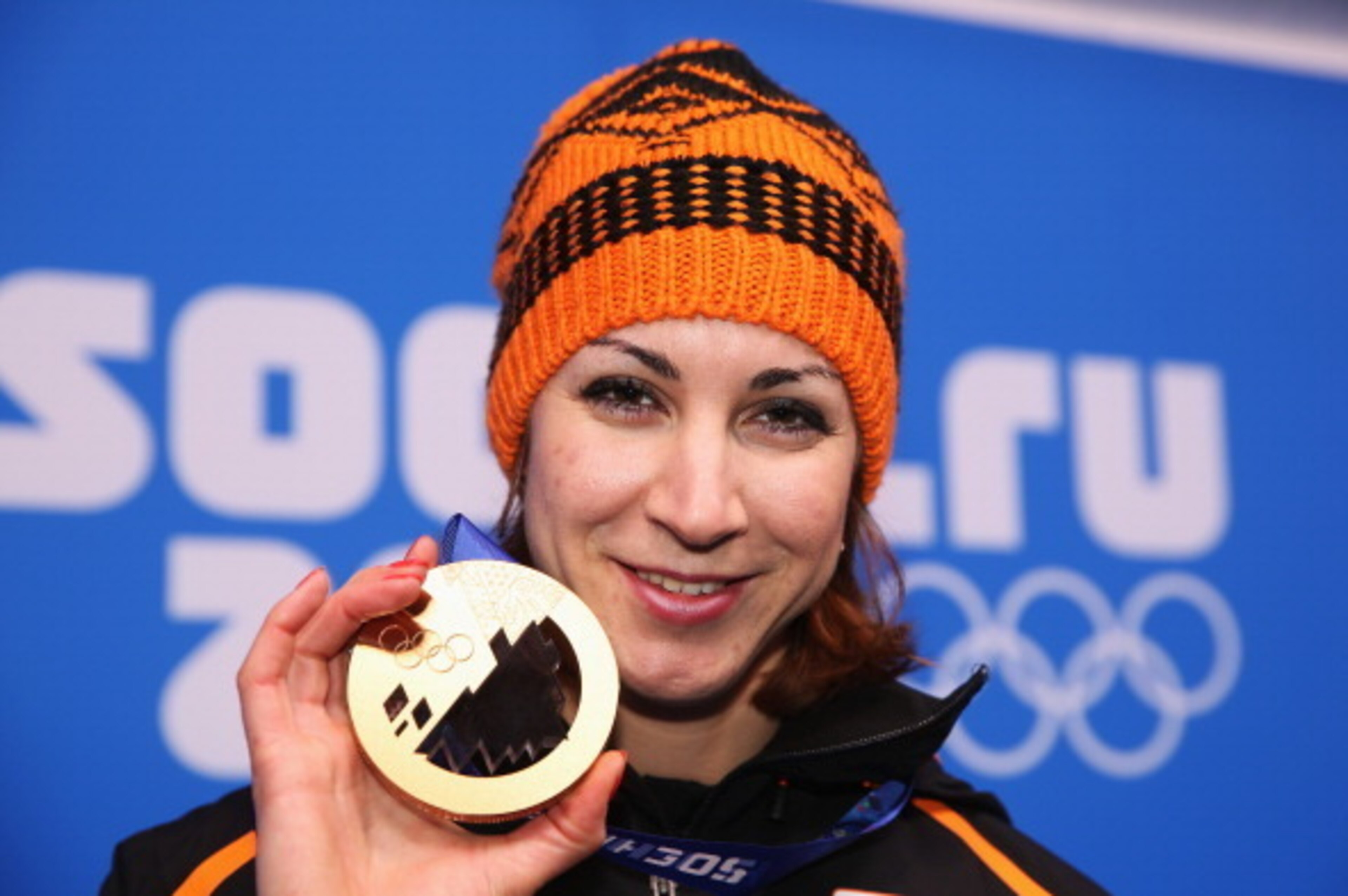 SOCHI, RUSSIA - FEBRUARY 12:  Bronze medalist Margot Boer of the Netherlands celebrates during the medal ceremony for the Women's 500m on day five of the Sochi 2014 Winter Olympics at Medals Plaza on February 12, 2014 in Sochi, Russia.  (Photo by Robert C