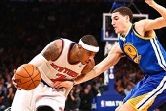 Feb. 27, 2013; New York, NY, USA; New York Knicks small forward Carmelo Anthony (7) drives to the net around Golden State Warriors shooting guard Klay Thompson (11) during the fourth quarter at Madison Square Garden. Knicks won 109-105. Mandatory Credit: