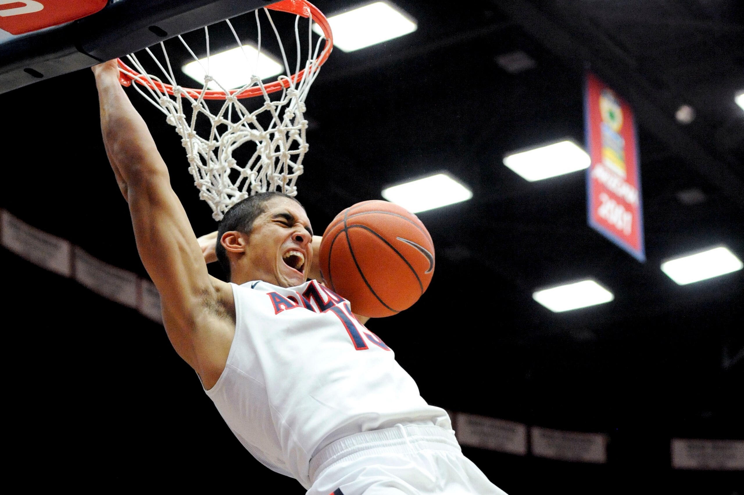 Jan 26, 2014; Tucson, AZ, USA; Arizona Wildcats guard Nick Johnson (13) dunks the ball during the second half against the Utah Utes at McKale Center. Arizona won 65-56. Mandatory Credit: Casey Sapio-USA TODAY Sports