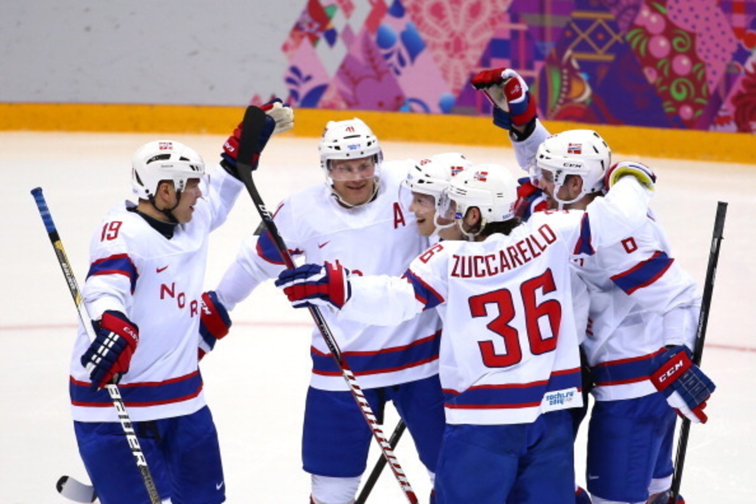 SOCHI, RUSSIA - FEBRUARY 13:  Per-Aage Skroeder #19, Patrick Thoresen #41 of Norway Mats Zuccarello Aasen #36 of Norway celebrate with teammates after Mathis Olimb #46 of Norway scored a goal against Canada during the Men's Ice Hockey Preliminary Round Gr