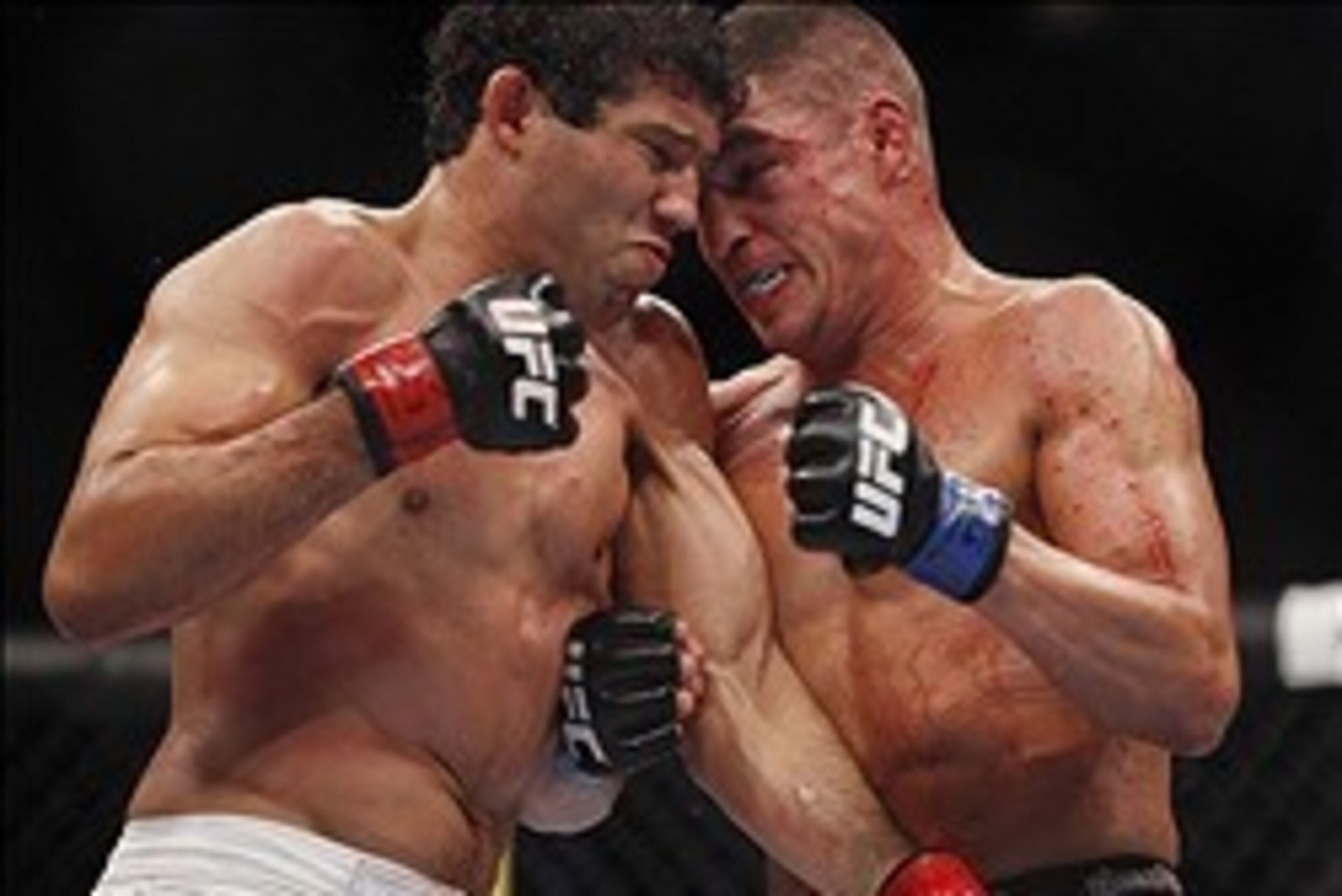 Oct 19, 2013; Houston, TX, USA; Gilbert Melendez (red gloves) fights against Diego Sanchez (blue gloves) in their lightweight bout during UFC 166 at Toyota Center. Mandatory Credit: Andrew Richardson-USA TODAY Sports