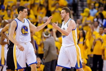 OAKLAND, CA - MAY 16: David Lee #10 and Klay Thompson #11 of the Golden State Warriors celebrate while playing the San Antonio Spurs in Game Six of the Western Conference Semifinals during the 2013 NBA Playoffs on May 16, 2013 at Oracle Arena in Oakland, 