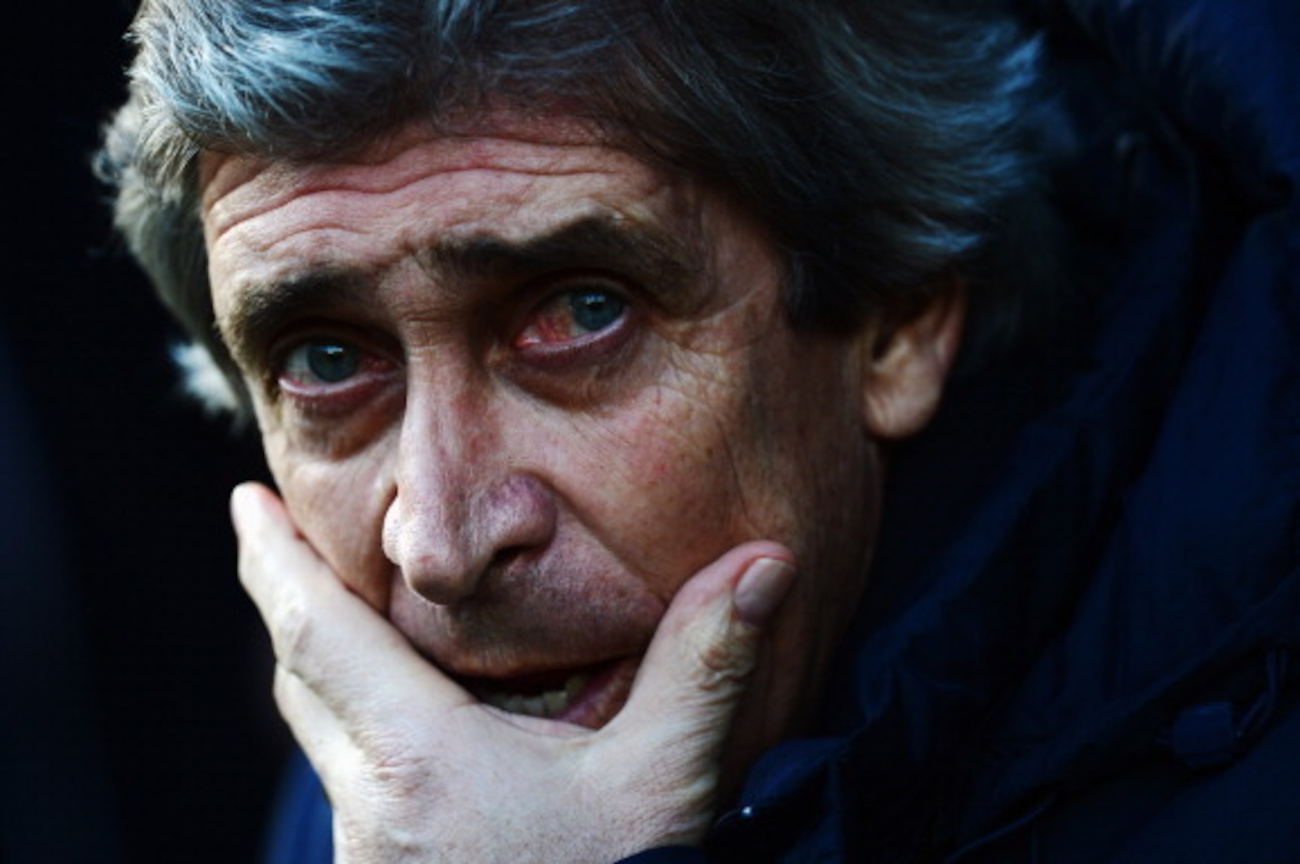 NORWICH, ENGLAND - FEBRUARY 08:  Manchester City manager Manuel Pellegrini looks on before the Barclays Premier League match between Norwich City and Manchester City at Carrow Road on February 8, 2014 in Norwich, England.  (Photo by Jamie McDonald/Getty I