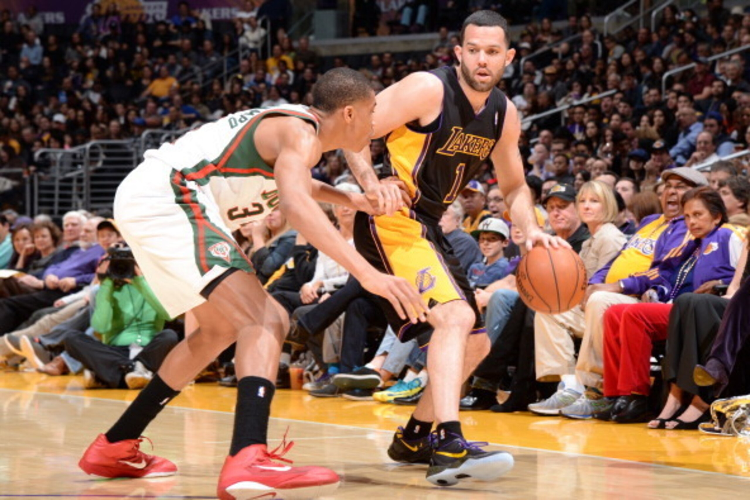 LOS ANGELES, CA - DECEMBER 31: Jordan Farmar #1 of the Los Angeles Lakers handles the basketball during a game against the Milwaukee Bucks at STAPLES Center on December 31, 2013 in Los Angeles, California. NOTE TO USER: User expressly acknowledges and agr