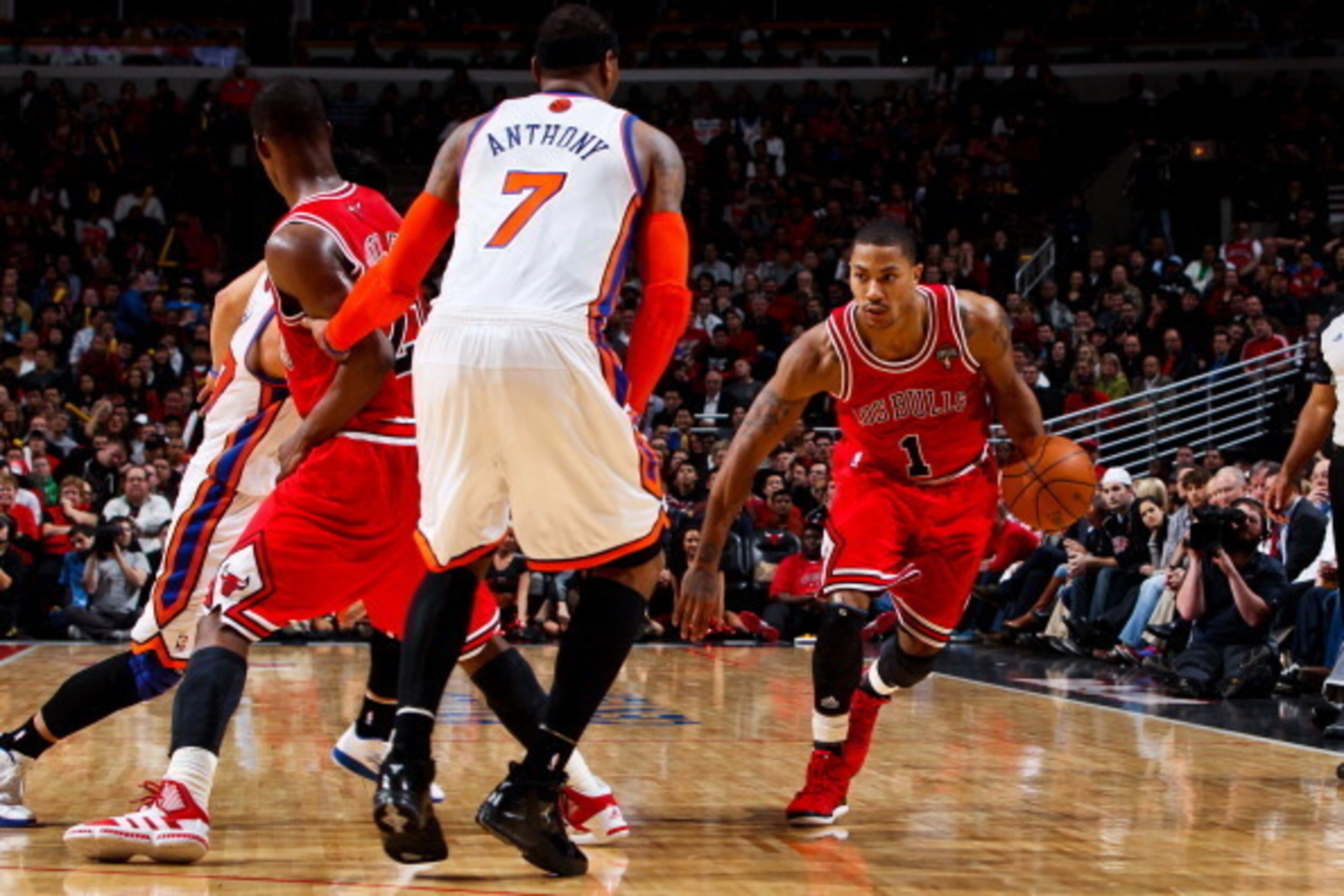 CHICAGO, IL - MARCH 12: Derrick Rose #1 of the Chicago Bulls drives on a screen by teammate Jimmy Butler #21 against Carmelo Anthony #7 and Jeremy Lin #17 of the New York Knicks on March 12, 2012 at the United Center in Chicago, Illinois. NOTE TO USER: U CHICAGO, IL - MARCH 12: Derrick Rose #1 of the Chicago Bulls drives on a screen by teammate Jimmy Butler #21 against Carmelo Anthony #7 and Jeremy Lin #17 of the New York Knicks on March 12, 2012 at the United Center in Chicago, Illinois. NOTE TO USER: U
