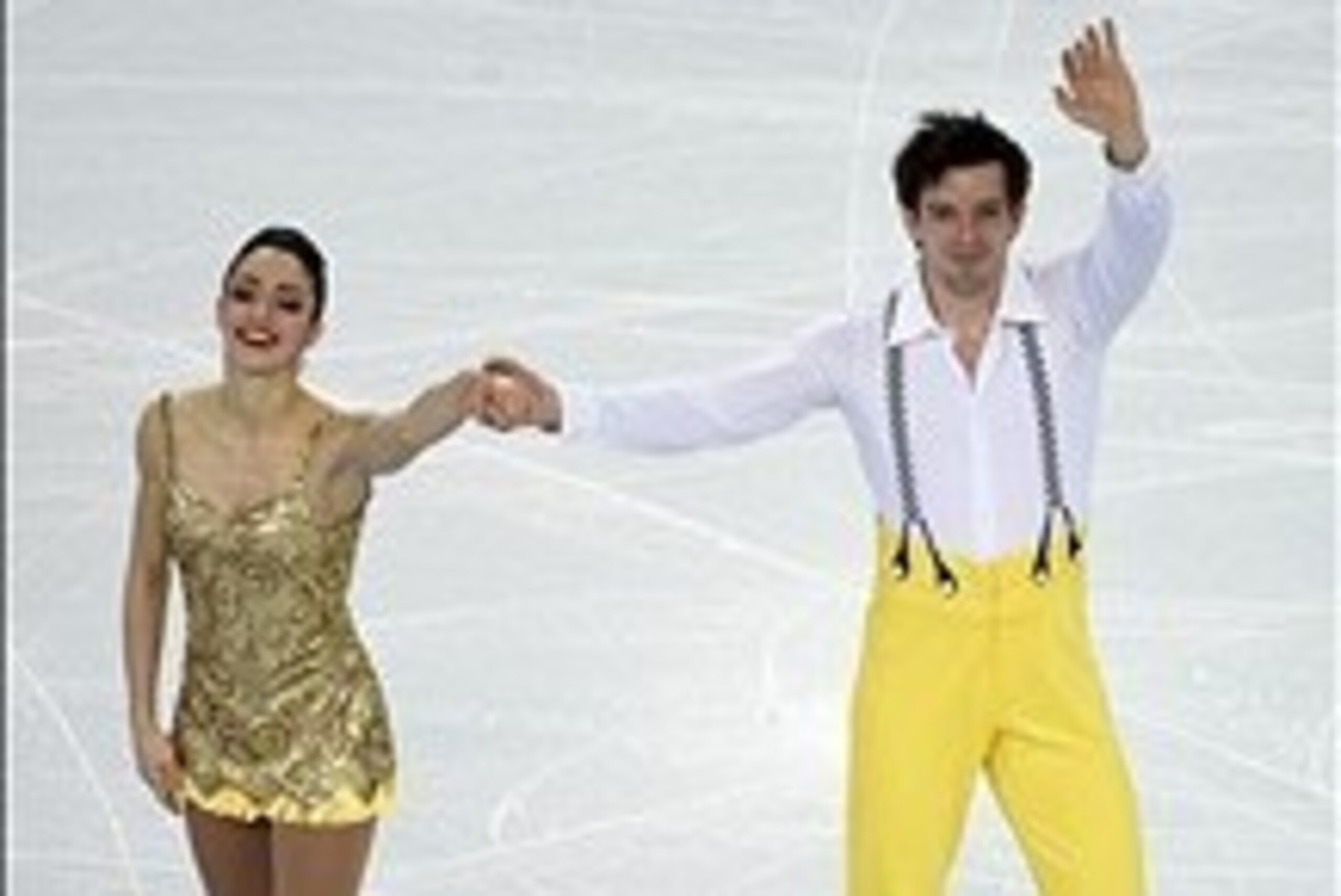 Feb 6, 2014; Sochi, RUSSIA; Stefania Berton and Ondrej Hotarek (ITA) wave to the crowd after performing in the figure skating team pairs short program during the Sochi 2014 Olympic Winter Games at Iceberg Skating Palace. Mandatory Credit: Richard Mackson-