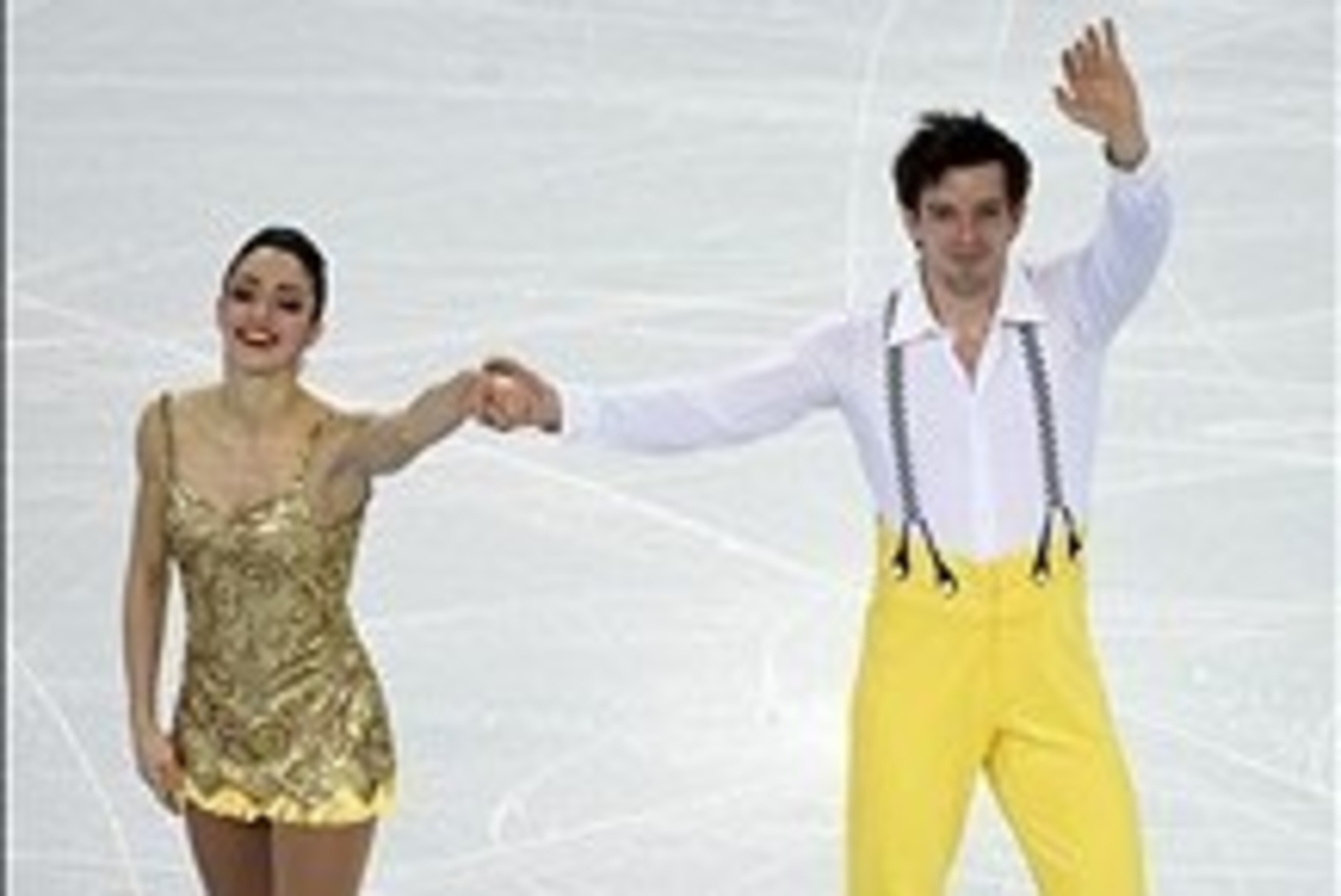 Feb 6, 2014; Sochi, RUSSIA; Stefania Berton and Ondrej Hotarek (ITA) wave to the crowd after performing in the figure skating team pairs short program during the Sochi 2014 Olympic Winter Games at Iceberg Skating Palace. Mandatory Credit: Richard Mackson-