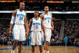 NEW ORLEANS - DECEMBER 3:  David West #30, Chris Paul #3 and Tyson Chandler #6 of the New Orleans Hornets on the court during the game against the Phoenix Suns at New Orleans Arena on December 3, 2008 in New Orleans, Louisiana.  The Hornets won 104-91.  N