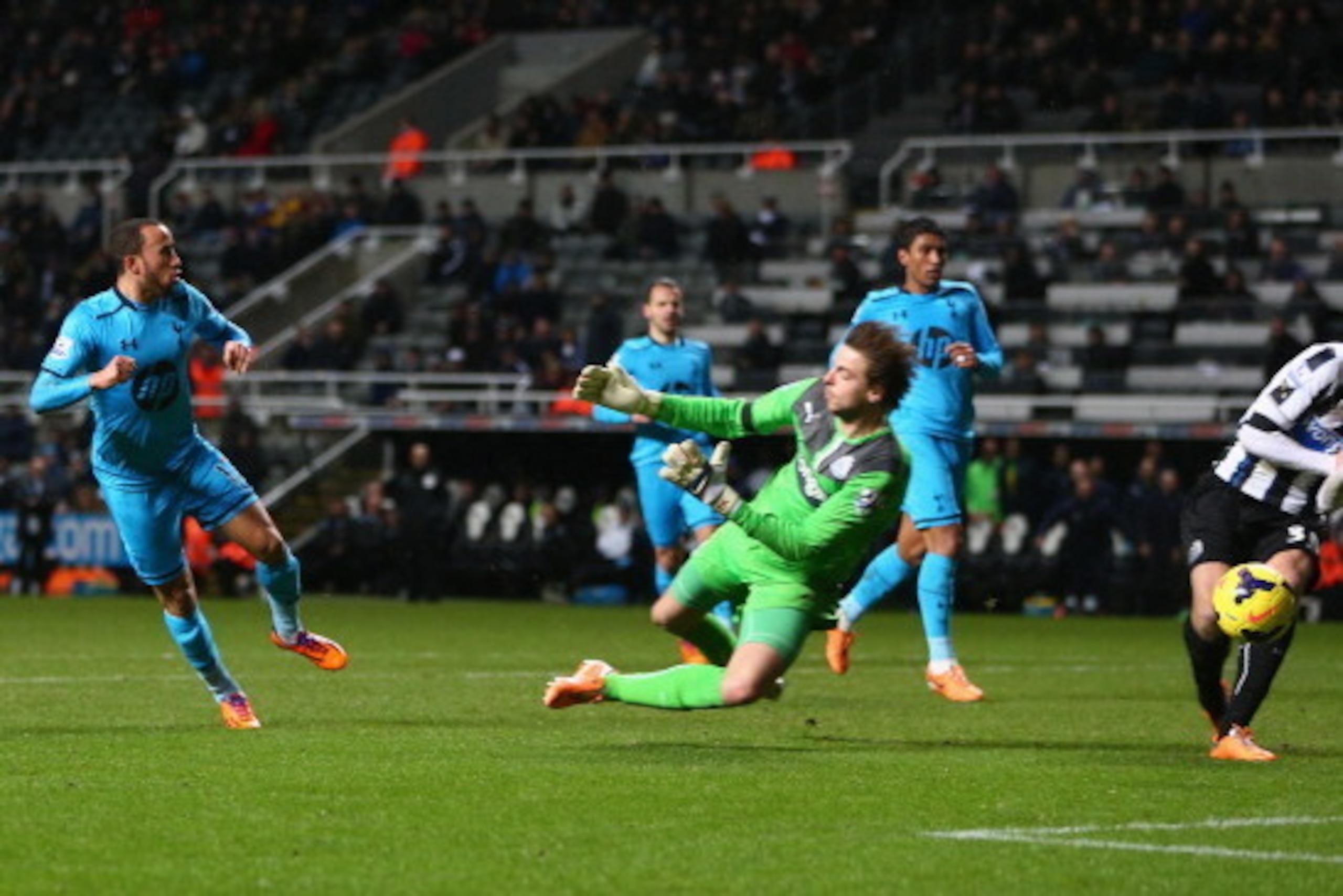 NEWCASTLE UPON TYNE, ENGLAND - FEBRUARY 12:  Andros Townsend (L) of Tottenham Hotspurhas his shot blocked by Tim Krul (C) of Newcastle United during the Barclays Premier League match between Newcastle United and Tottenham Hotspur at St James' Park on Febr