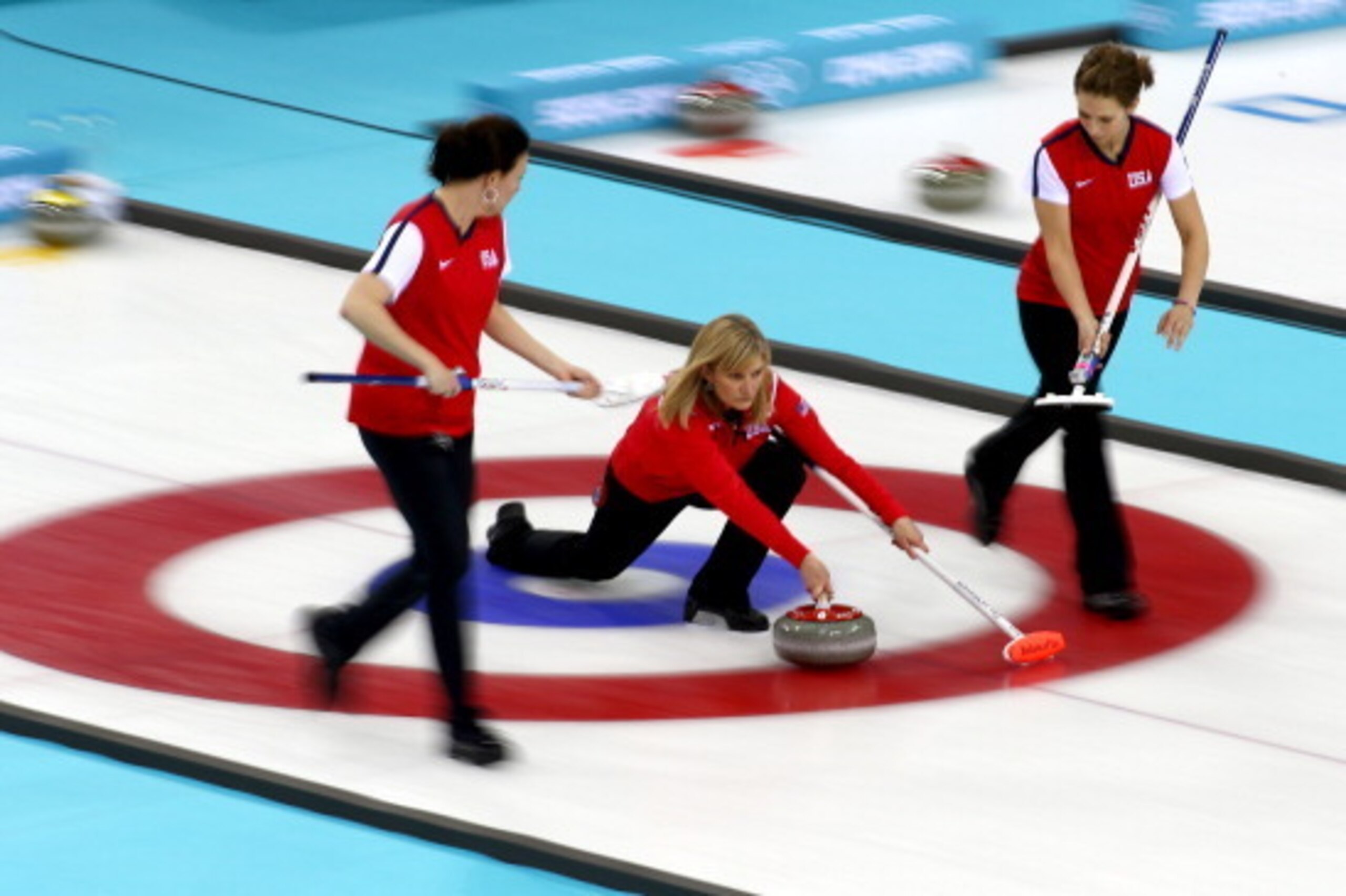SOCHI, RUSSIA - FEBRUARY 14: Teammates Ann Swisshlem, Erika Brown and Jessica Shultz of the USA compete against Denmark during the Women's Curling Round Robin match on day seven of the Sochi 2014 Winter Olympics at Ice Cube Curling Center on February 14, SOCHI, RUSSIA - FEBRUARY 14: Teammates Ann Swisshlem, Erika Brown and Jessica Shultz of the USA compete against Denmark during the Women's Curling Round Robin match on day seven of the Sochi 2014 Winter Olympics at Ice Cube Curling Center on February 14,