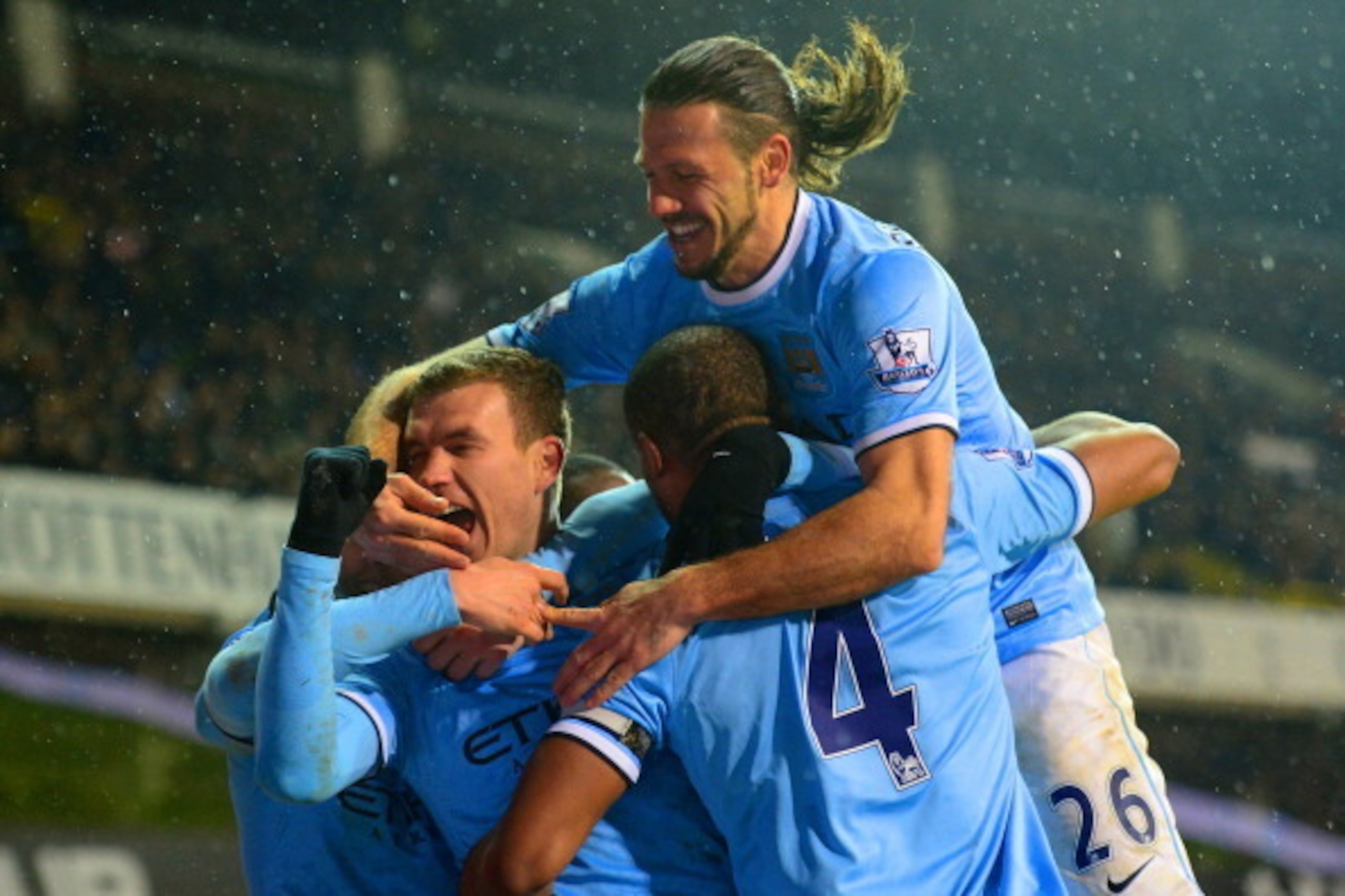 LONDON, ENGLAND - JANUARY 29:  Edin Dzeko of Manchester City celebrates scoroing their third goal with team mates during the Barclays Premier League match between Tottenham Hotspur and Manchester City at White Hart Lane on January 29, 2014 in London, Engl