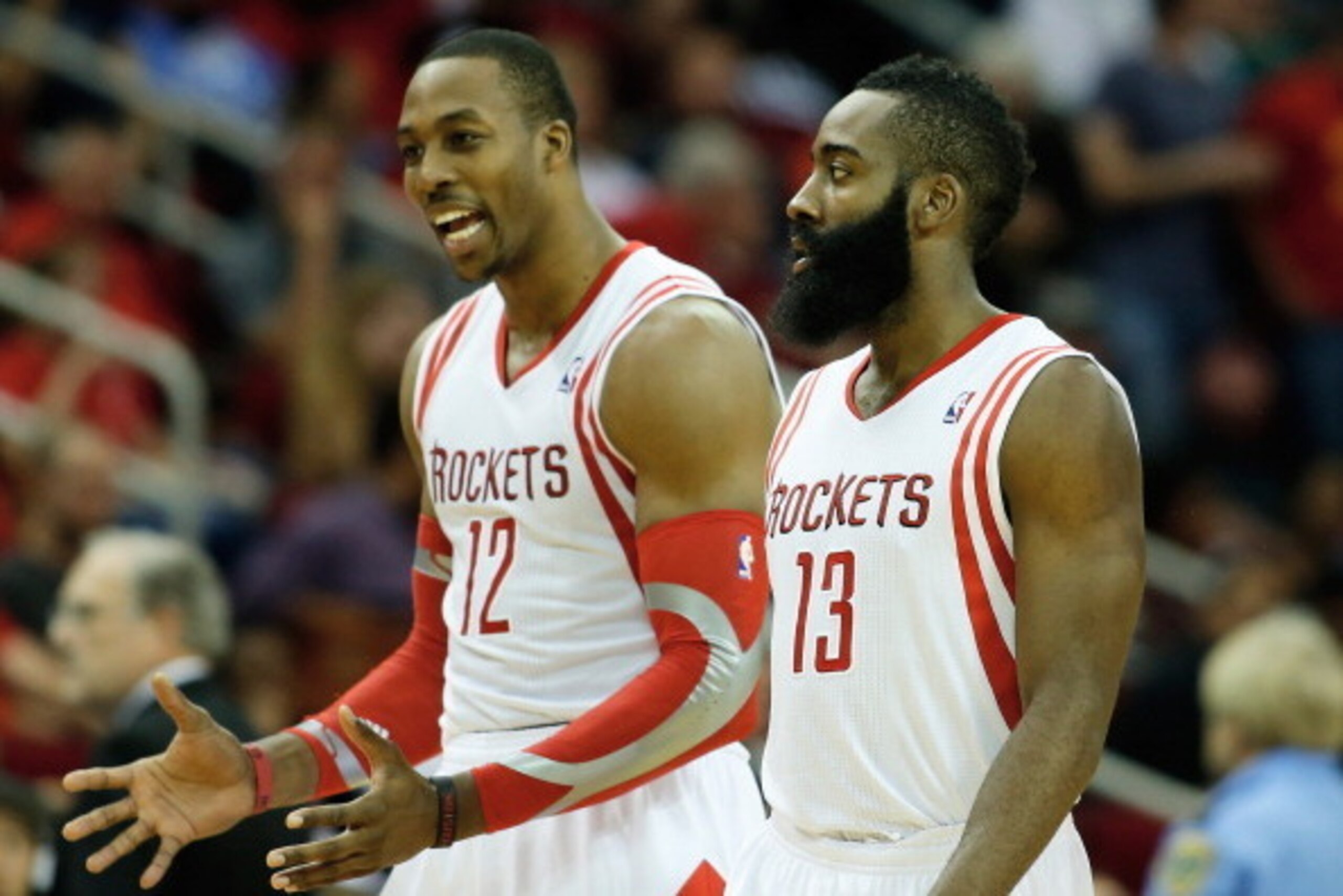 HOUSTON, TX - NOVEMBER 11: Dwight Howard #12 and James Harden #13 of the Houston Rockets walk off the court during the game against the Toronto Raptors at Toyota Center on November 11, 2013 in Houston, Texas. NOTE TO USER: User expressly acknowledges and HOUSTON, TX - NOVEMBER 11: Dwight Howard #12 and James Harden #13 of the Houston Rockets walk off the court during the game against the Toronto Raptors at Toyota Center on November 11, 2013 in Houston, Texas. NOTE TO USER: User expressly acknowledges and