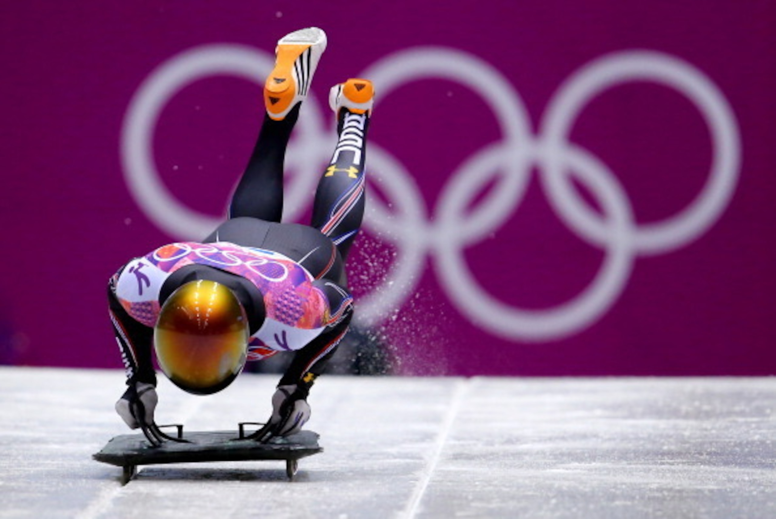 SOCHI, RUSSIA - FEBRUARY 14:  John Daly of the United States competes a run during the Men's Skeleton heats on Day 7 of the Sochi 2014 Winter Olympics at Sliding Center Sanki on February 14, 2014 in Sochi, Russia.  (Photo by Al Bello/Getty Images)