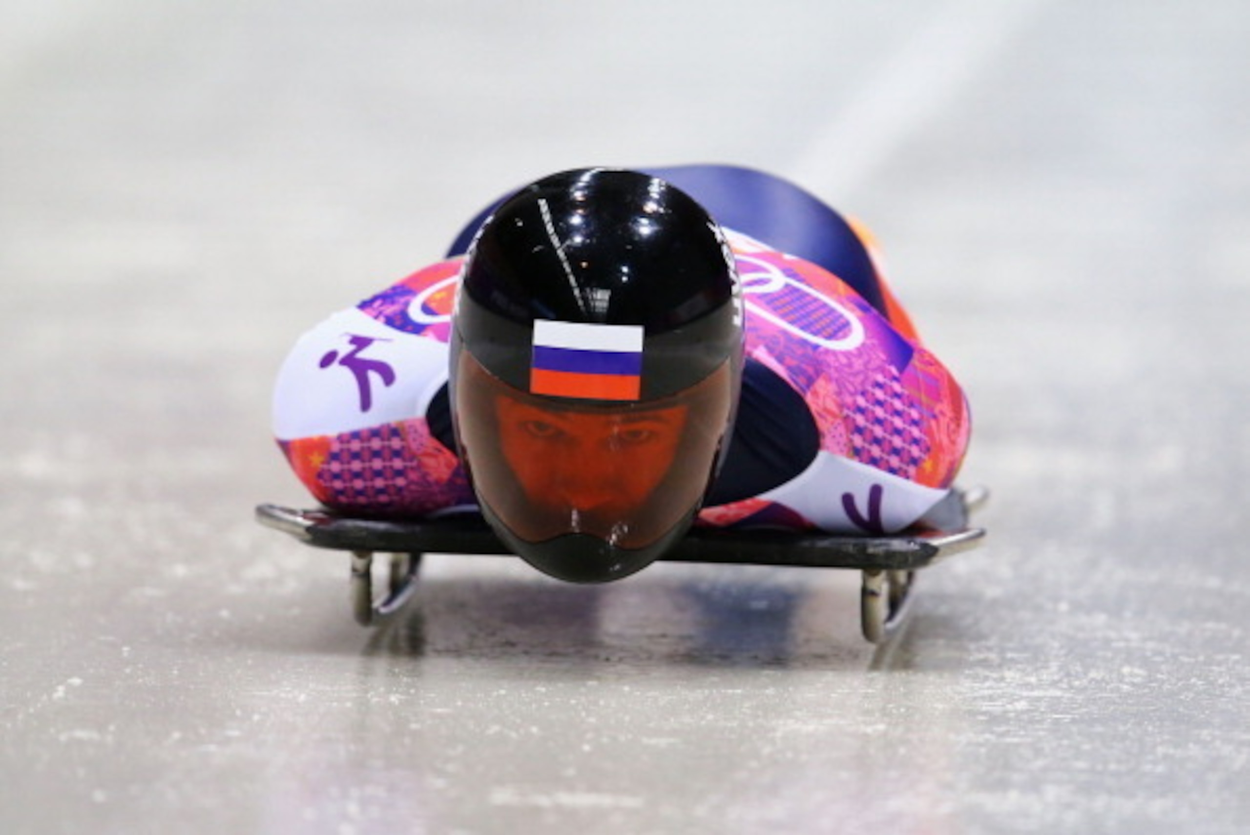 SOCHI, RUSSIA - FEBRUARY 14:  AlexanderÂ@Tretiakov of Russia competes a run during the Men's Skeleton heats on Day 7 of the Sochi 2014 Winter Olympics at Sliding Center Sanki on February 14, 2014 in Sochi, Russia.  (Photo by Al Bello/Getty Images)