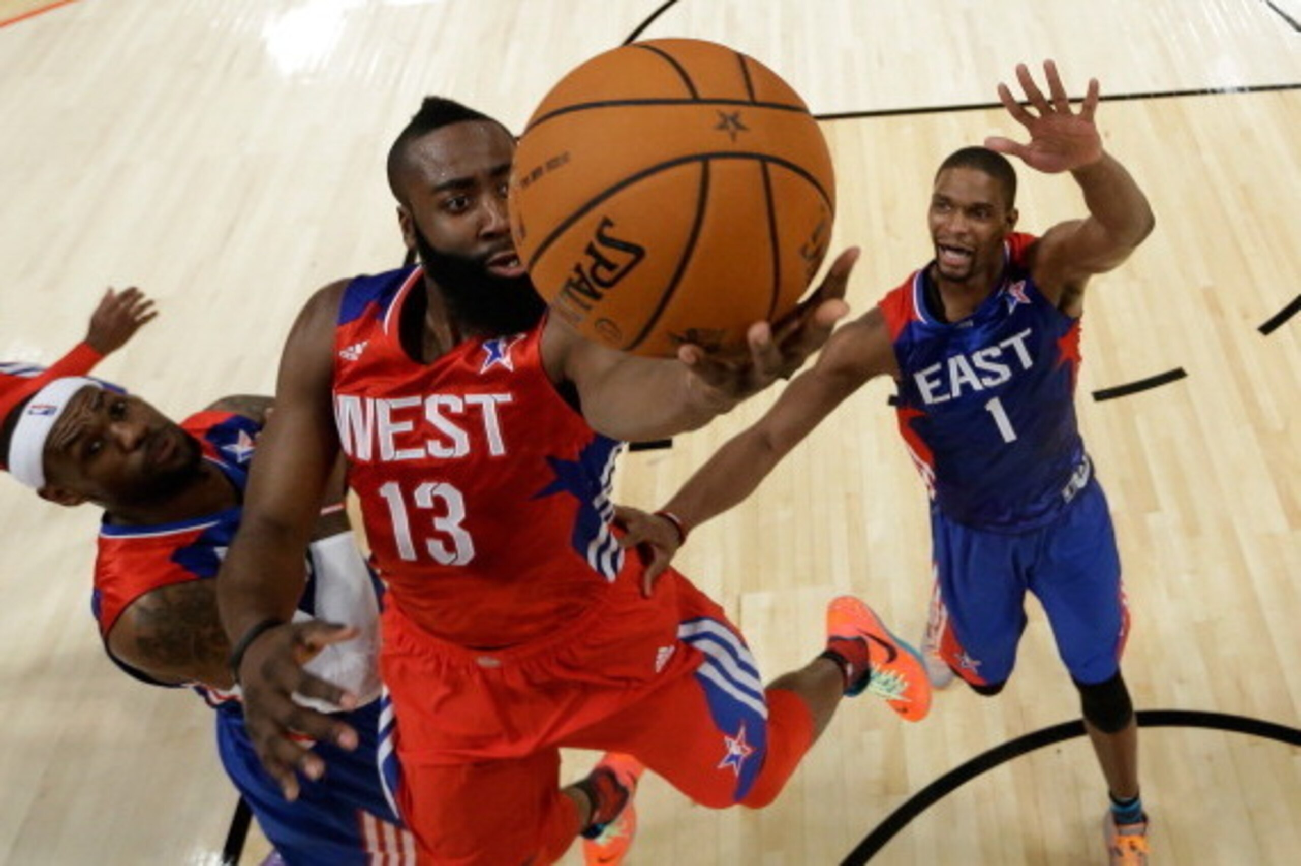 HOUSTON, TX - FEBRUARY 17: James Harden #13 of the Houston Rockets and the Western Conference goes up for a shot between LeBron James #6 and Chris Bosh #1 of the Eastern Conference during the 2013 NBA All-Star game at the Toyota Center on February 17, 20 HOUSTON, TX - FEBRUARY 17: James Harden #13 of the Houston Rockets and the Western Conference goes up for a shot between LeBron James #6 and Chris Bosh #1 of the Eastern Conference during the 2013 NBA All-Star game at the Toyota Center on February 17, 20