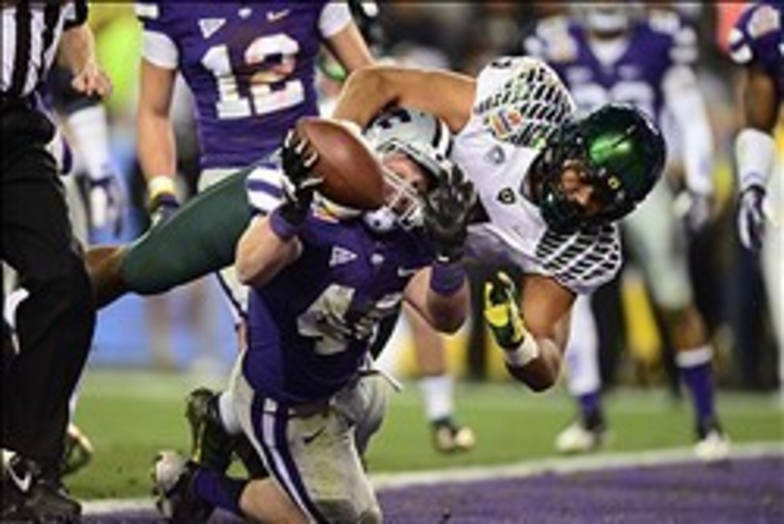Jan. 3, 2013; Glendale, AZ, USA: Oregon Ducks defensive lineman Arik Armstead (9) tackles Kansas State Wildcats defensive end Ryan Mueller (44) in the end zone on a blocked extra point in the third quarter during the 2013 Fiesta Bowl at University of Phoe