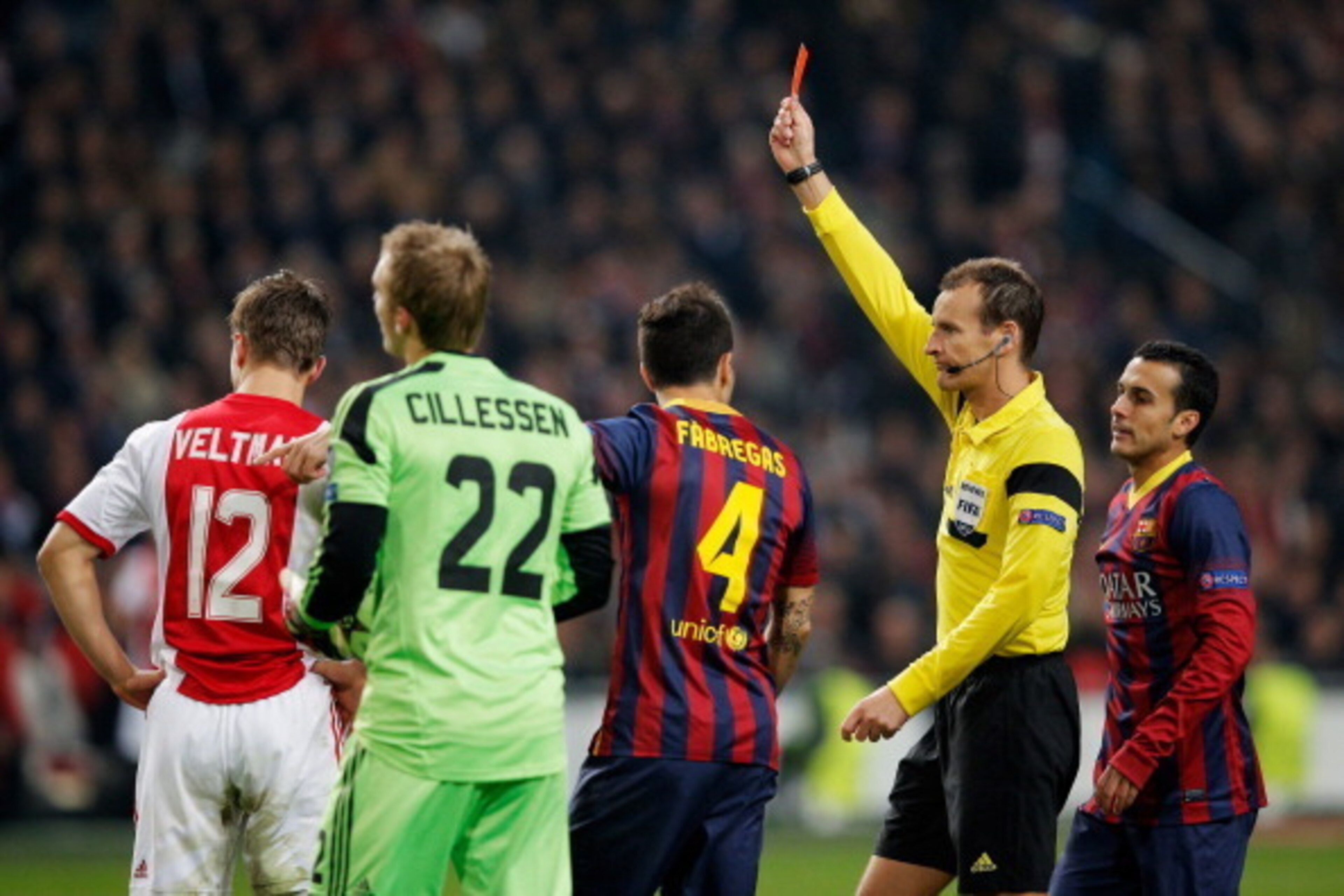 AMSTERDAM, NETHERLANDS - NOVEMBER 26:  Referee, Pavel Kralovec of Czech Republic shows Joel Veltman (#12) of Ajax a red card after he tackles and gives away a penalty on Neymar of Barcelona during the UEFA Champions League Group H match between Ajax Amste