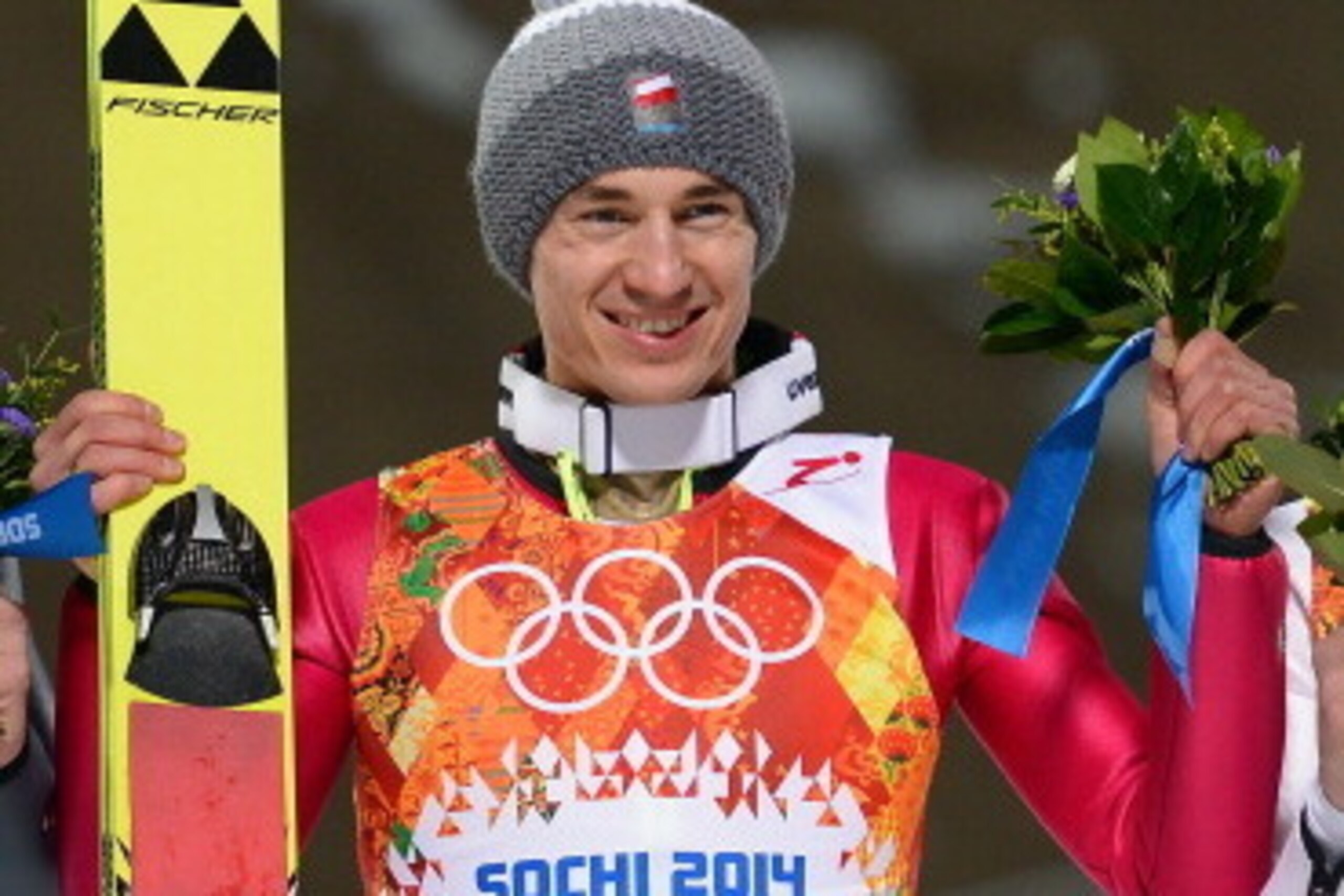 SOCHI, RUSSIA - FEBRUARY 09: Gold medalist Kamil Stoch of Poland smiles after the Men's Normal Hill Individual final on day 2 of the Sochi 2014 Winter Olympics at RusSki Gorki Jumping Center on February 9, 2014 in Sochi, Russia.  (Photo by Lars Baron/Gett