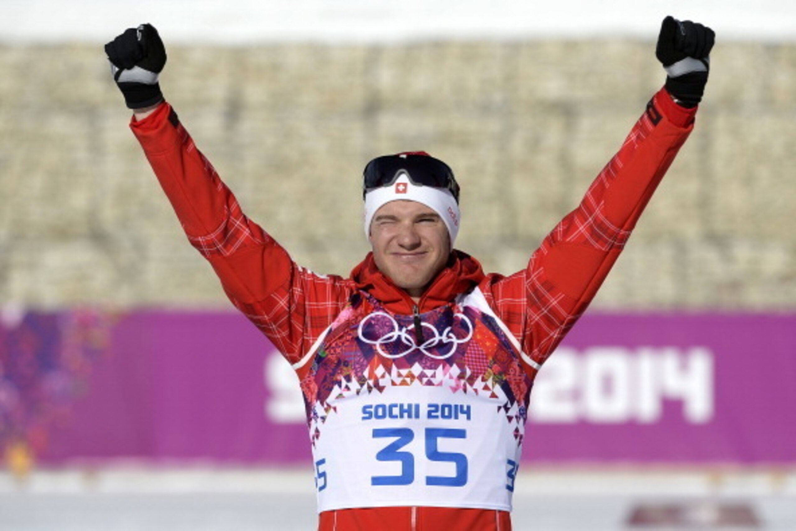 SOCHI, RUSSIA - FEBRUARY 14: (FRANCE OUT) Dario Cologna of Switzerland wins gold medal during the Cross-Country Men's 15km Classic at the Laura Cross-country Ski & Biathlon Center on February 14, 2014 in Sochi, Russia. (Photo by Vianney Thibaut/Agence Zoo