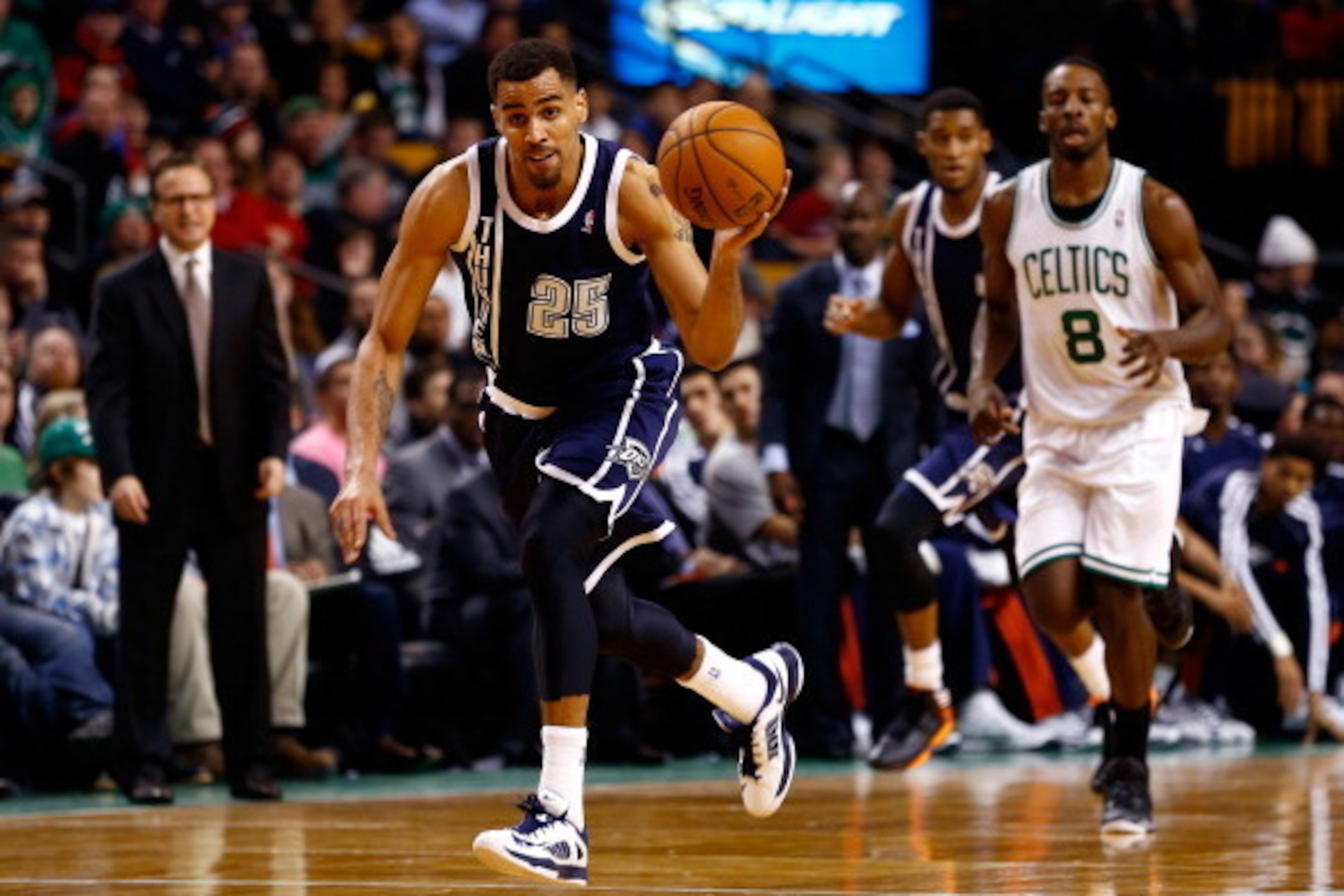 BOSTON, MA - JANUARY 24: Thabo Sefolosha #25 of the Oklahoma City Thunder brings the ball up the floor against the Boston Celtics during a game at the TD Garden on January 24, 2014 in Boston, Massachusetts. NOTE TO USER: User expressly acknowledges and ag
